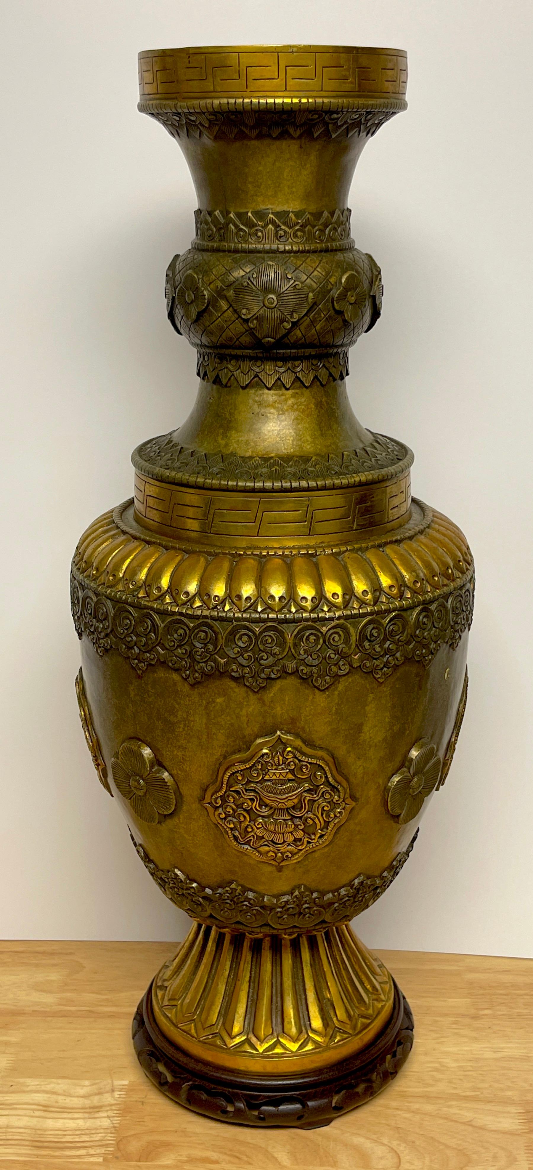 Large Chinese-Tibetan Gilt Bronze 'Offering' temple vase & stand
Impressive, well cast with numerous examples of geometric engraving, applied cast medallions and flowerheads. A unique feature of this vase is a continuous rim of skulls, the lower