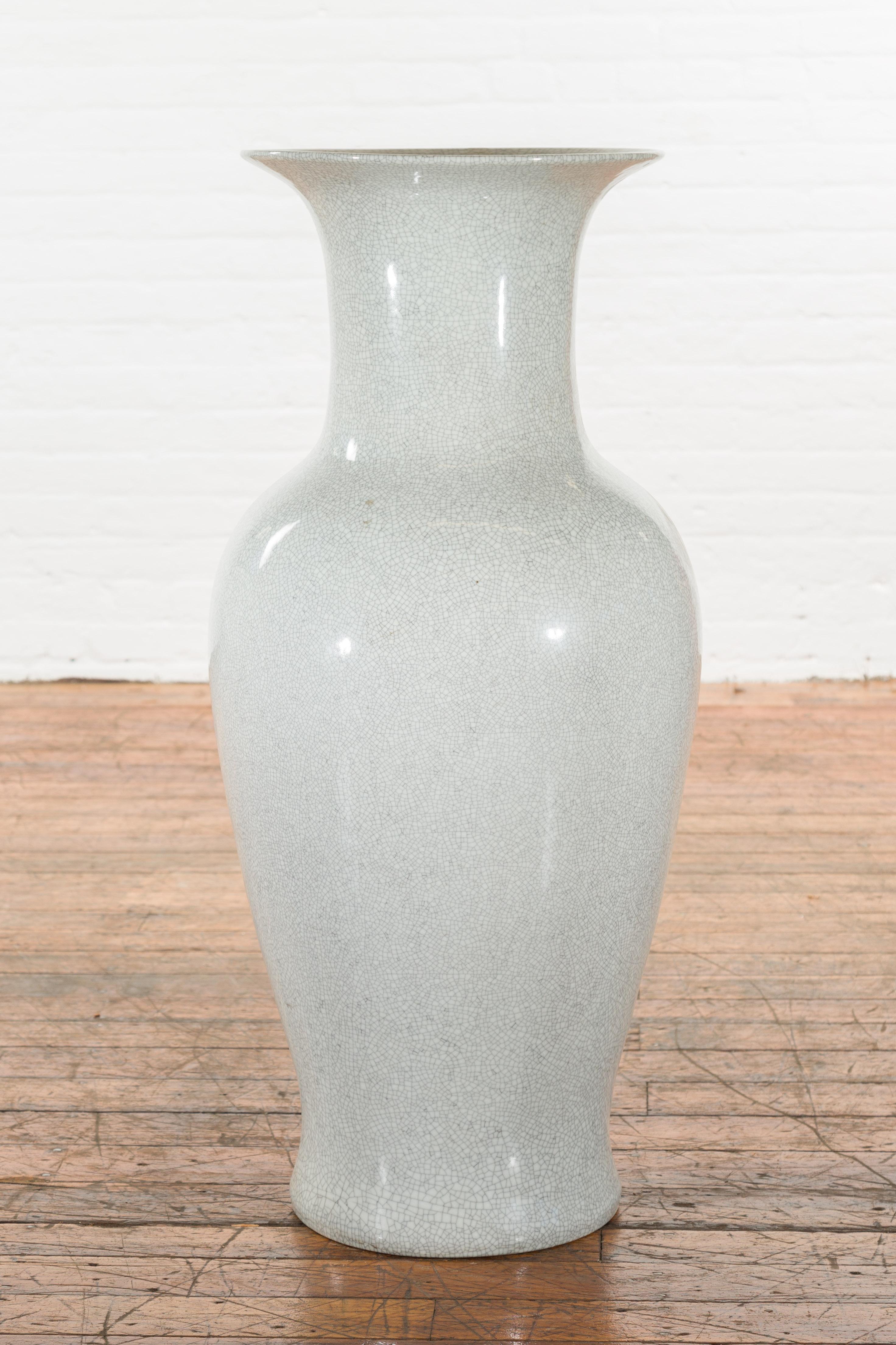 A Chinese vintage extra large grey altar vase from the mid 20th century, with crackle finish. Created in China during the midcentury period, this extra large vase features a flaring neck (with a 6.5
