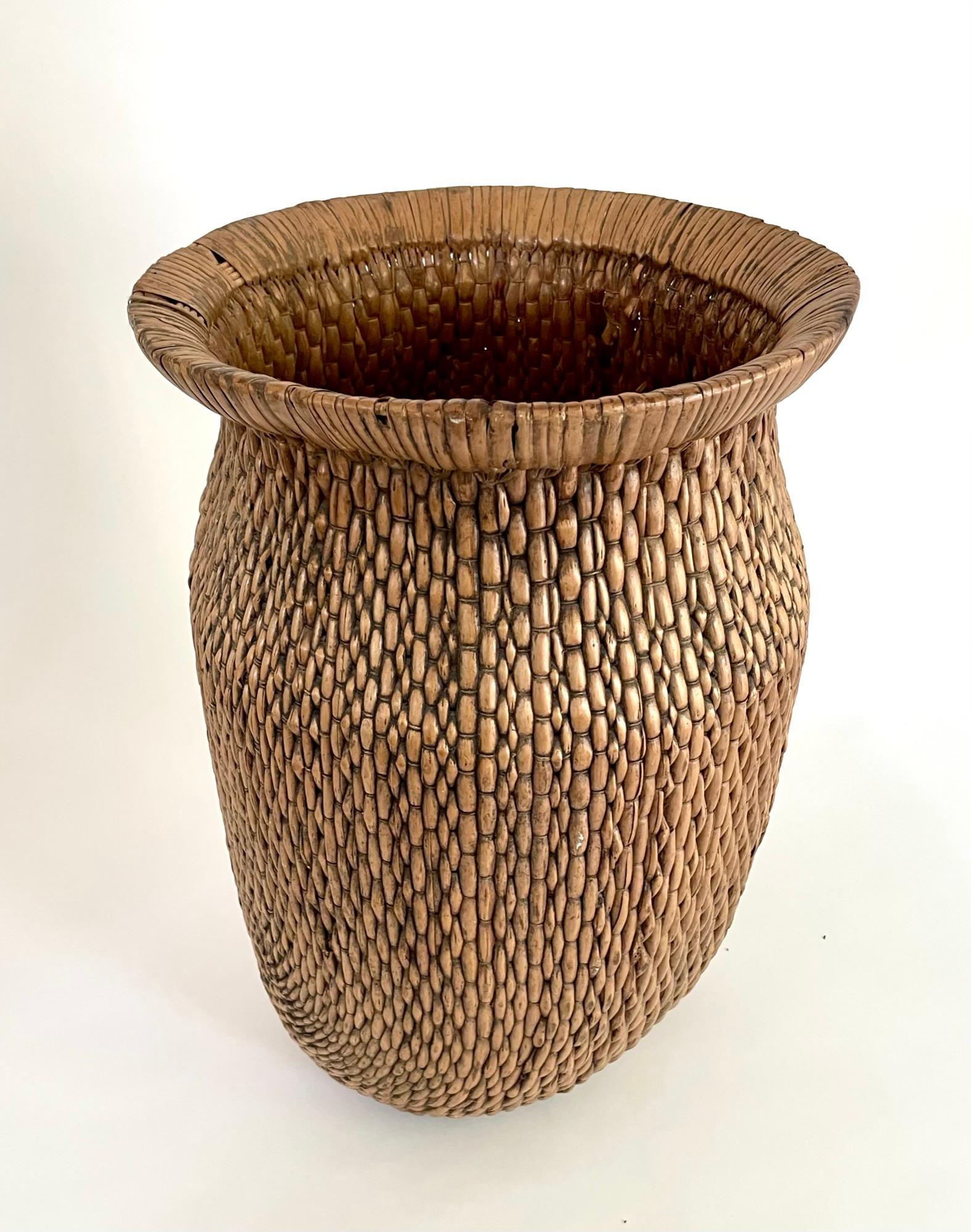 Early 20th century woven Chinese willow baskets. These beautifully shaped hand woven basket were originally used in the kitchen and gardens.