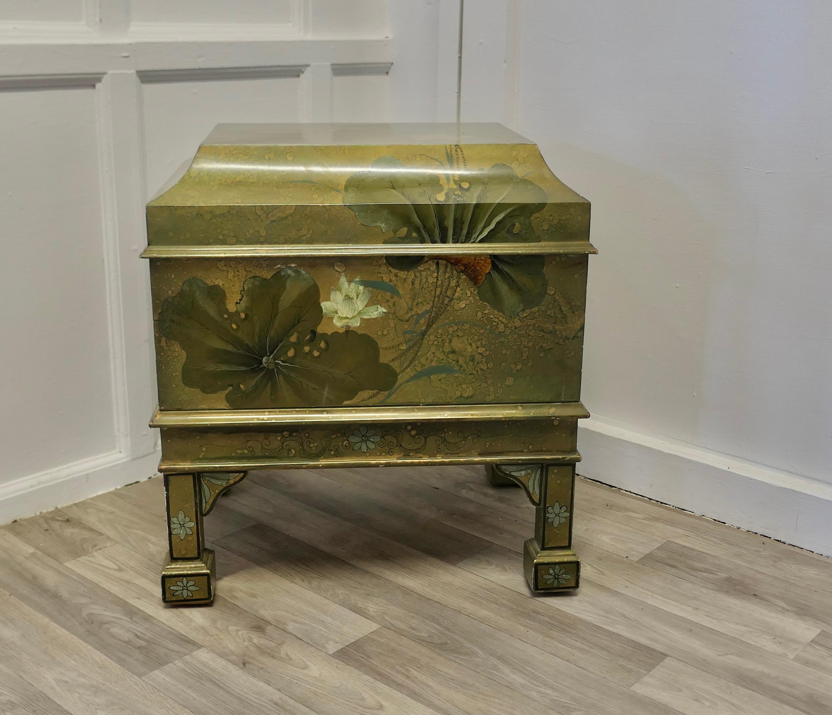 Large Chinoiserie Cellarette or Drinks Cabinet on Stand


This lovely piece is in the style of a Georgian cellarette, it has wonderful lacquer decoration showing an underwater view with waterlilies and other aquatic leaves. Inside there is a large