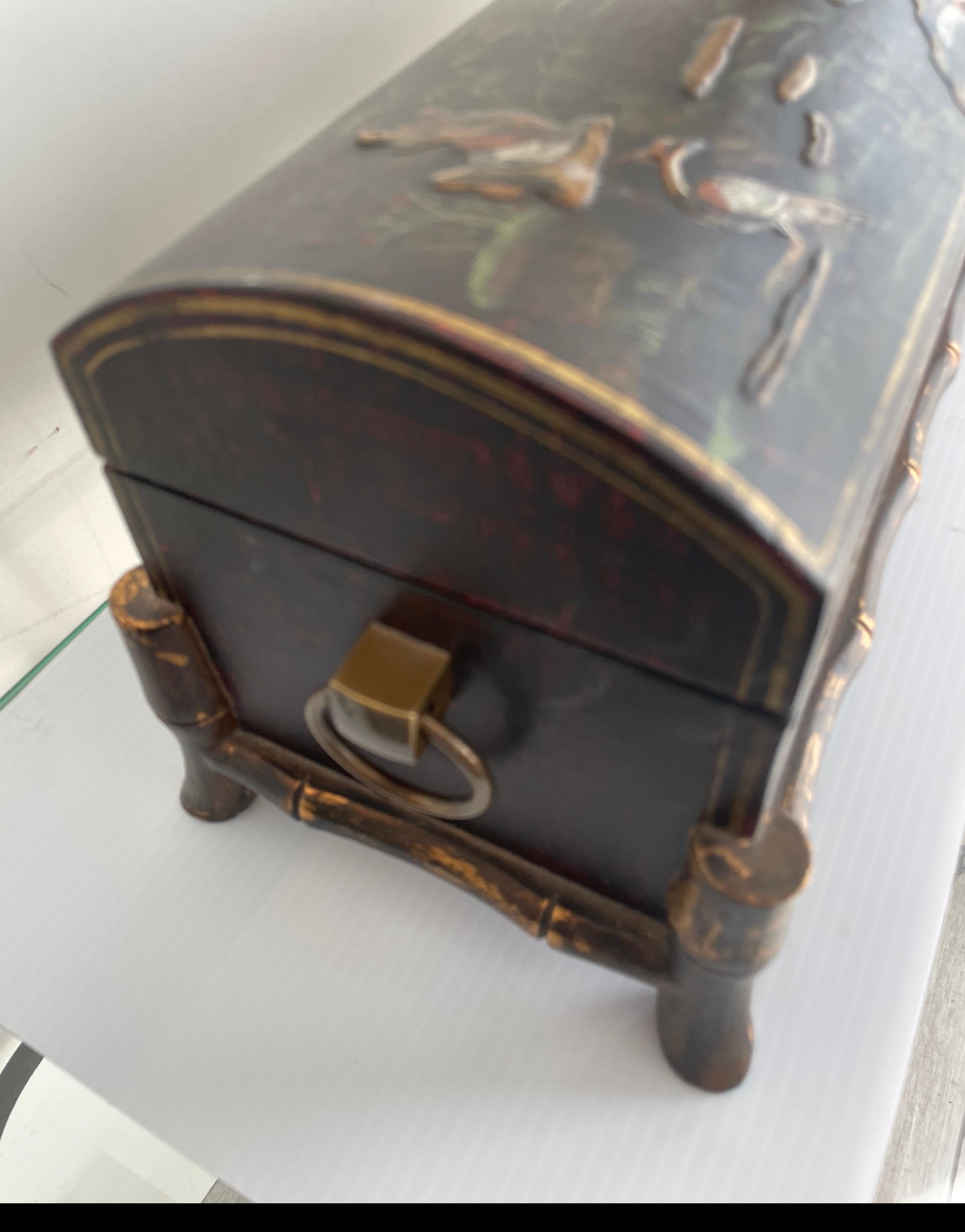 Large Chinoiserie box with painted scenes and gold faux bamboo trim.