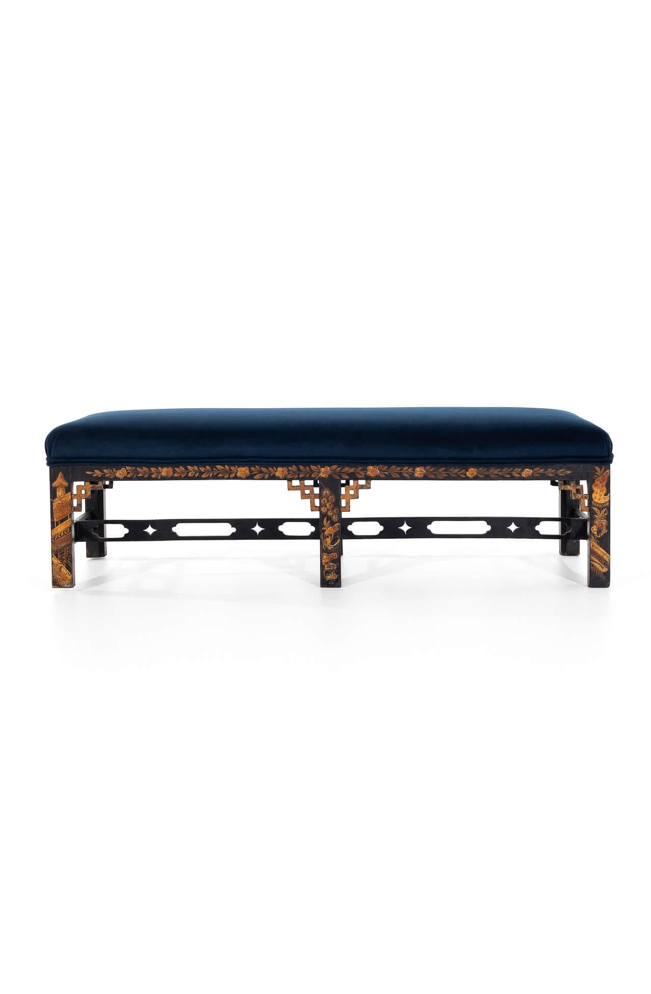 A low chinoiserie footstool with intricate hand-painted scenes from rural East Asia,  the decorative arts theatre, and music.

The ebonised beech frame stands on six block legs united by three central ornate stretchers.

Fully reupholstered with