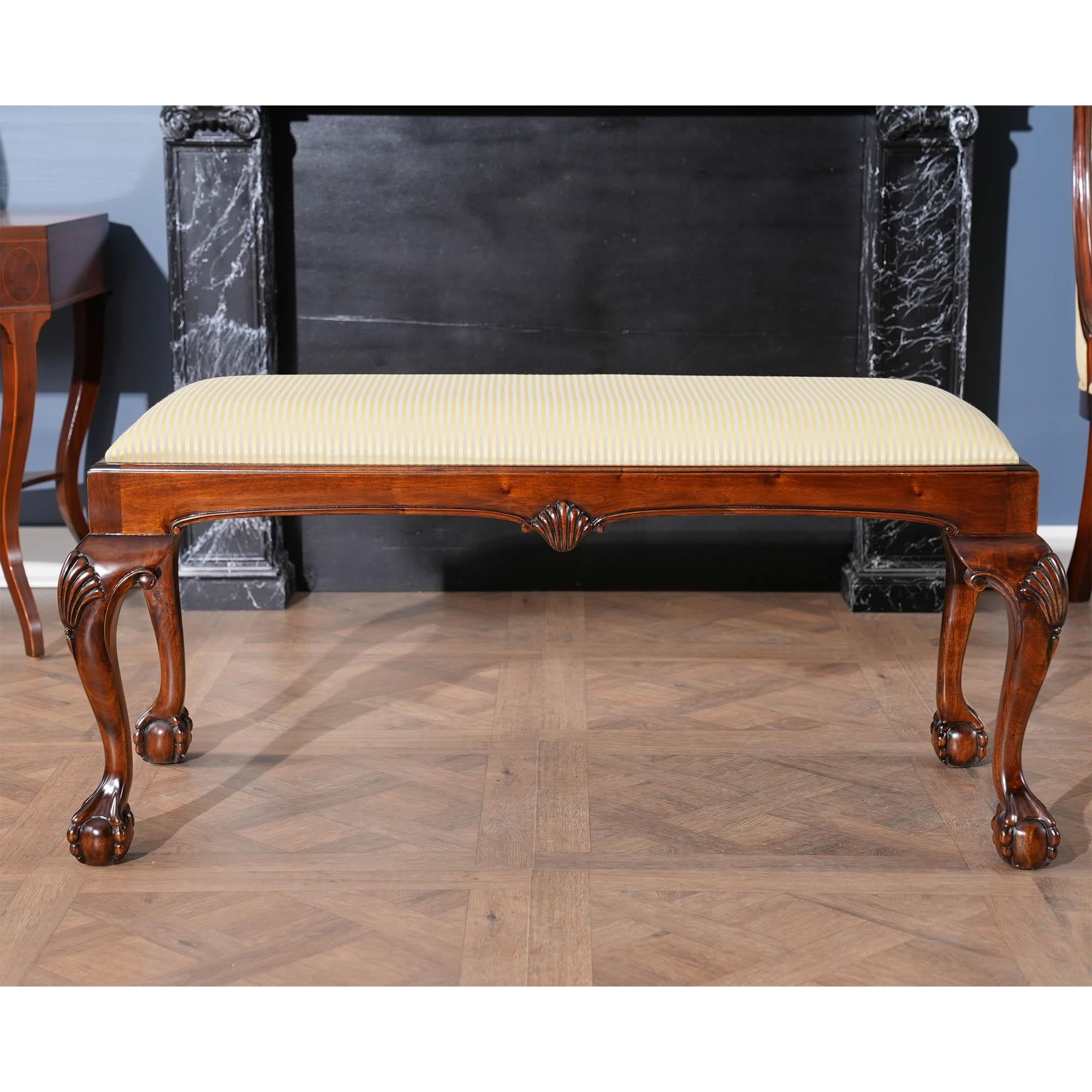 The Large Chippendale Bench is a high quality, solid mahogany large Chippendale style bench with upholstered drop in seat, shell carved knees on cabriole legs resting on ball and claw feet. Beautifully finished with neutral upholstery and ready to