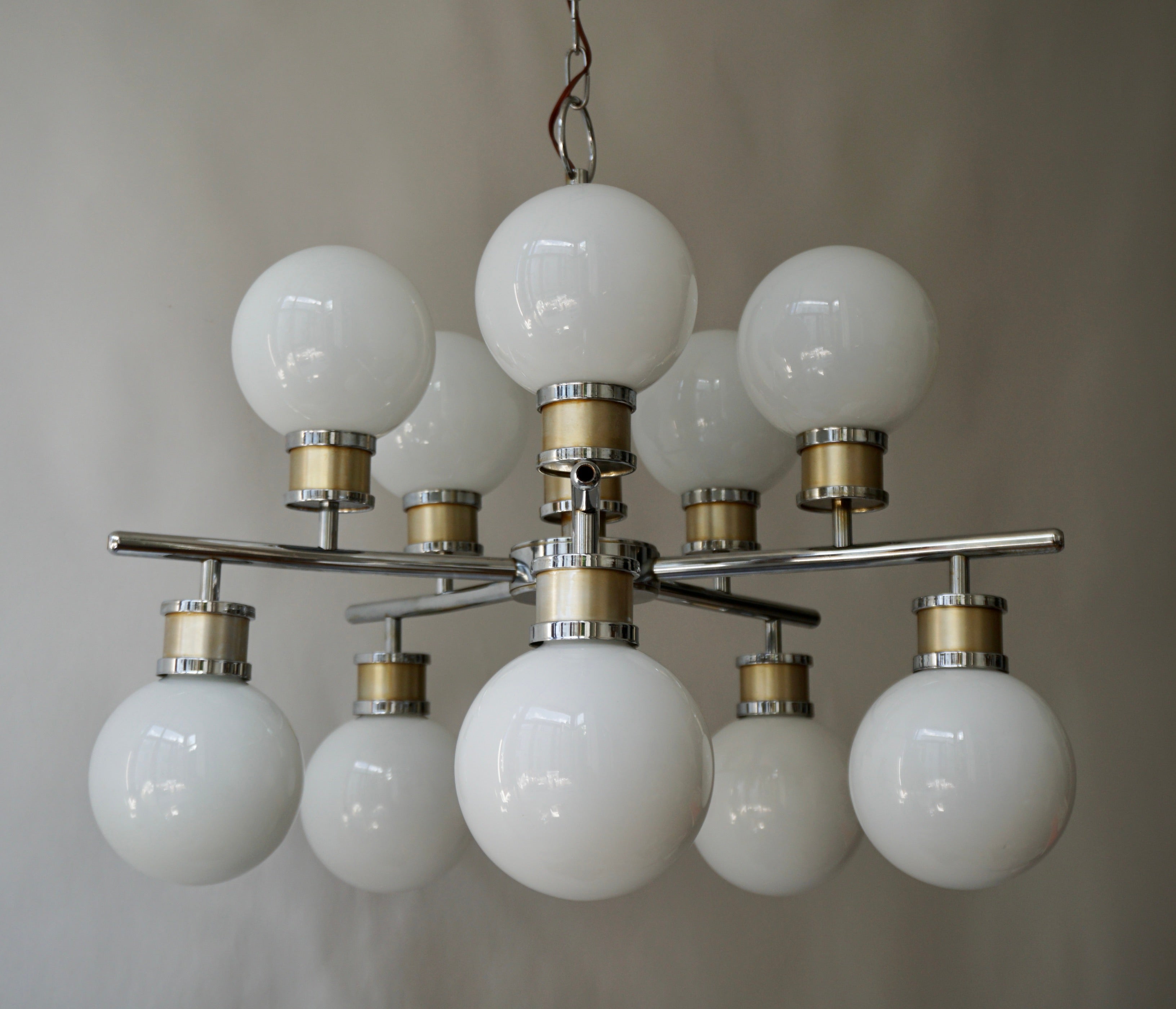 Design Classic Chrome Space Age hanging lamp. Eye catcher with 10 white opaline glass balls. This Design Classic space age lamp has no less than 10 white opaline spheres. The frame is completely chrome and completely intact. Due to the many opaline