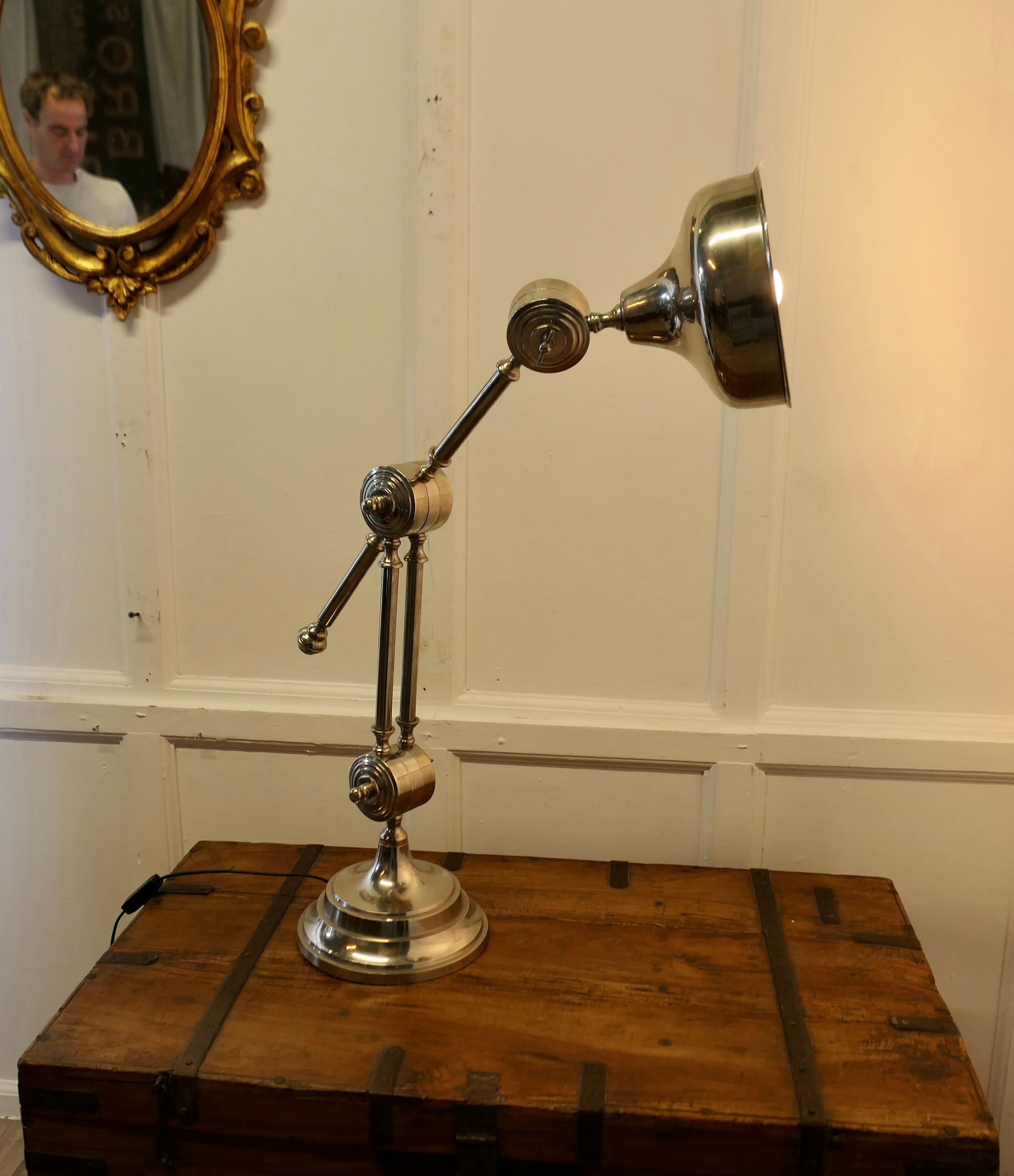 Large Chrome Industrial Style Desk Lamp 

A handsome and large piece, theDesk/Work lamp, in full working order, it has 3 articulated joints and it comes complete with its original large chrome shade
In good original rewired condition
The Lamp is 36”
