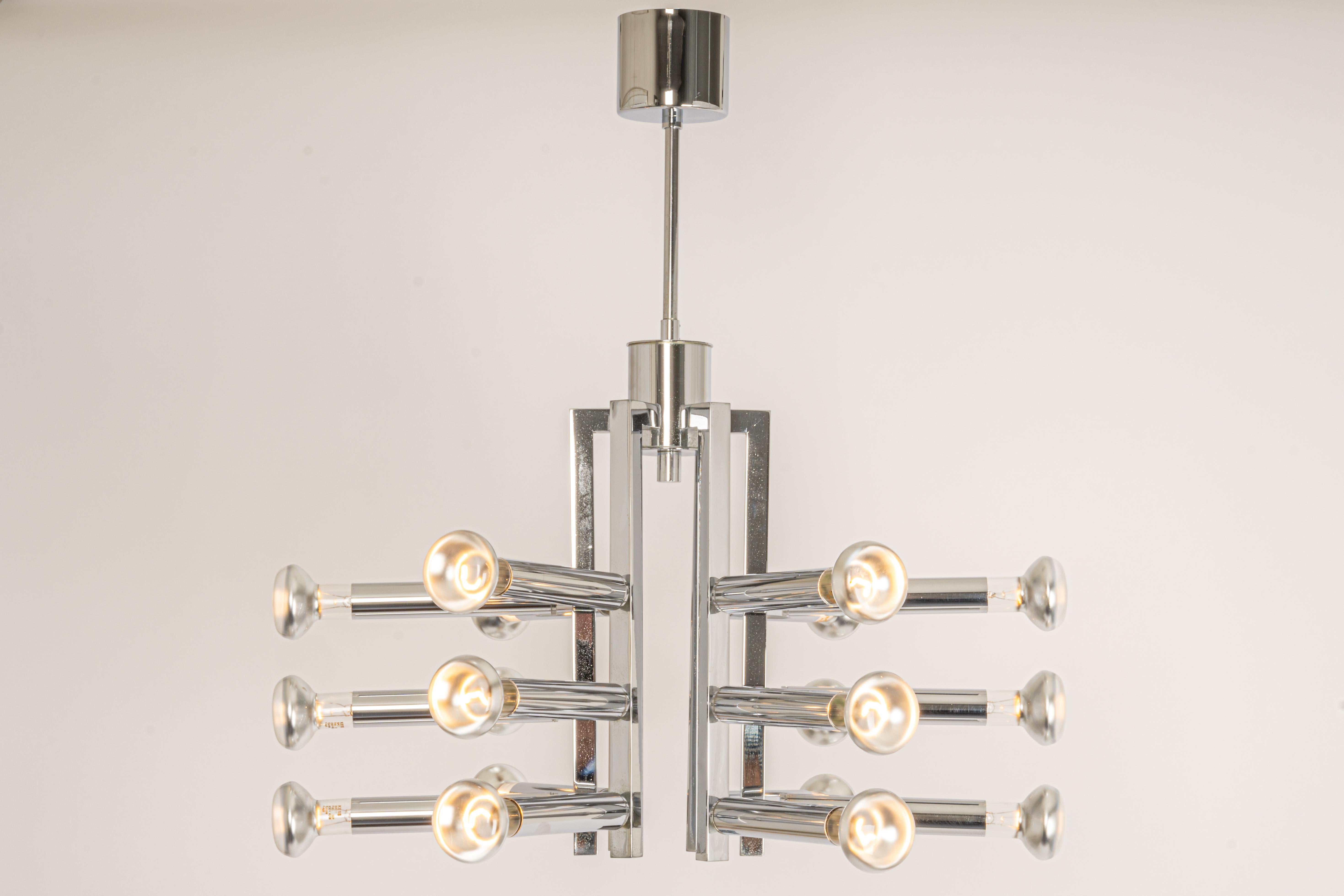 Stunning Sputnik chandelier designed by Cosack during the 1970s.
Nice Space Age design.

Sockets: It needs 18x E14 small bulbs.
Light bulbs are not included. It is possible to install this fixture in all countries (US, UK, Europe, Asia,
