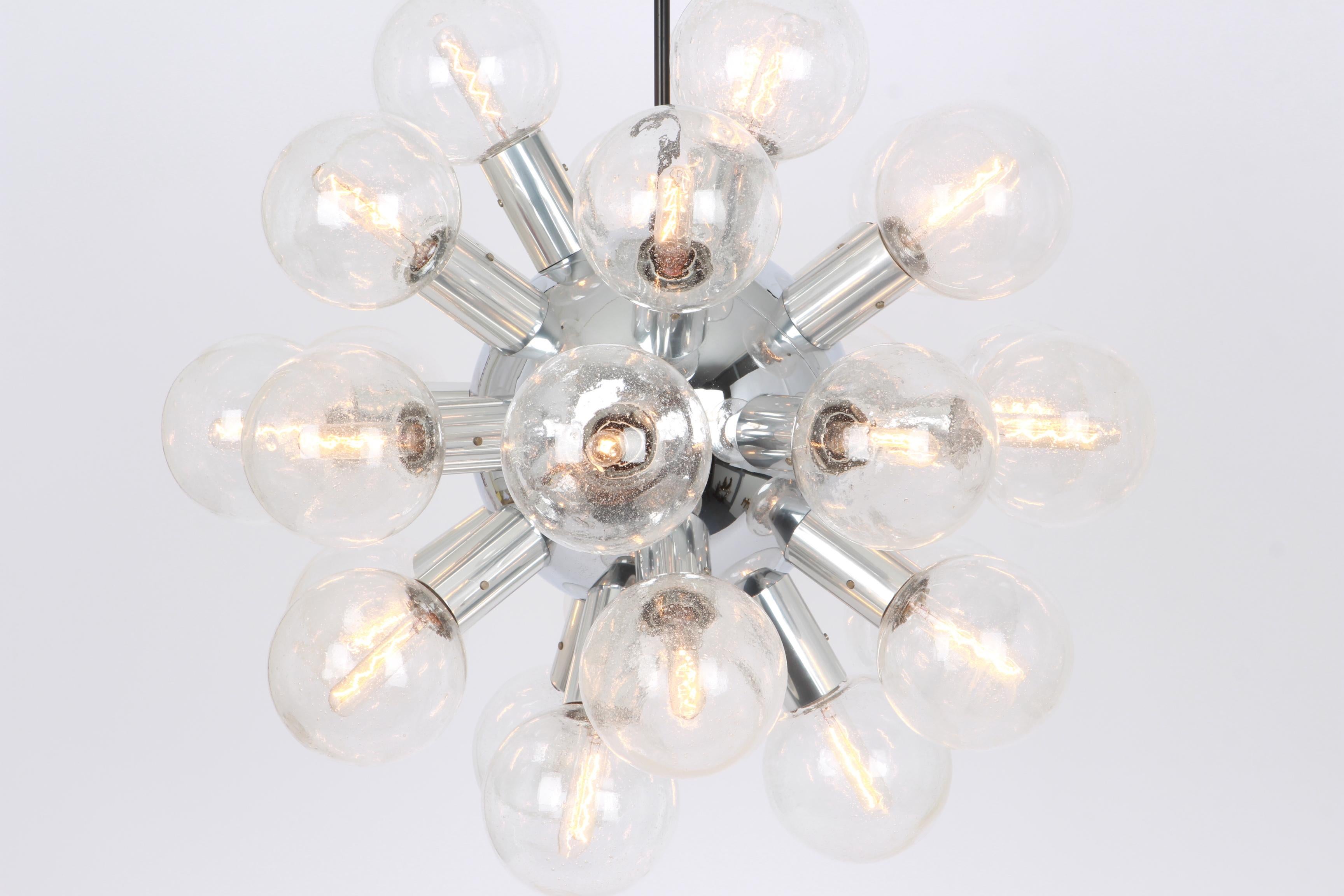 Exclusive Polished aluminum with 27 bubble glasses (mouth-blown)
Stunning Sputnik pendant lamp designed by Kalmar Leuchten during the 1970s.

Sockets: It needs 27x E14 small bulbs.
Light bulbs are not included. It is possible to install this
