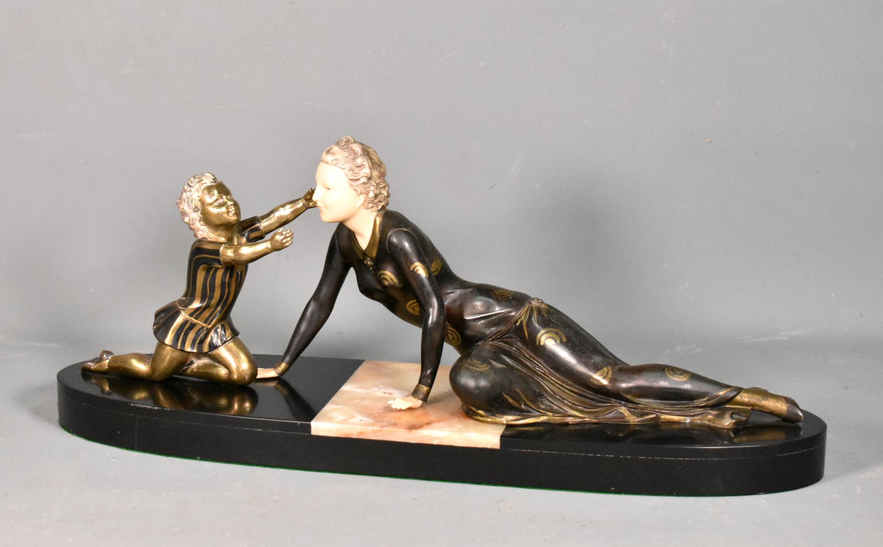Large French Art Deco Figurative Group by Menneville

This large art deco figural group depicts a reclining woman and a young child and is signed Menneville.

The artist Menneville was a prolific sculptor of Art Deco figurines. He also worked under