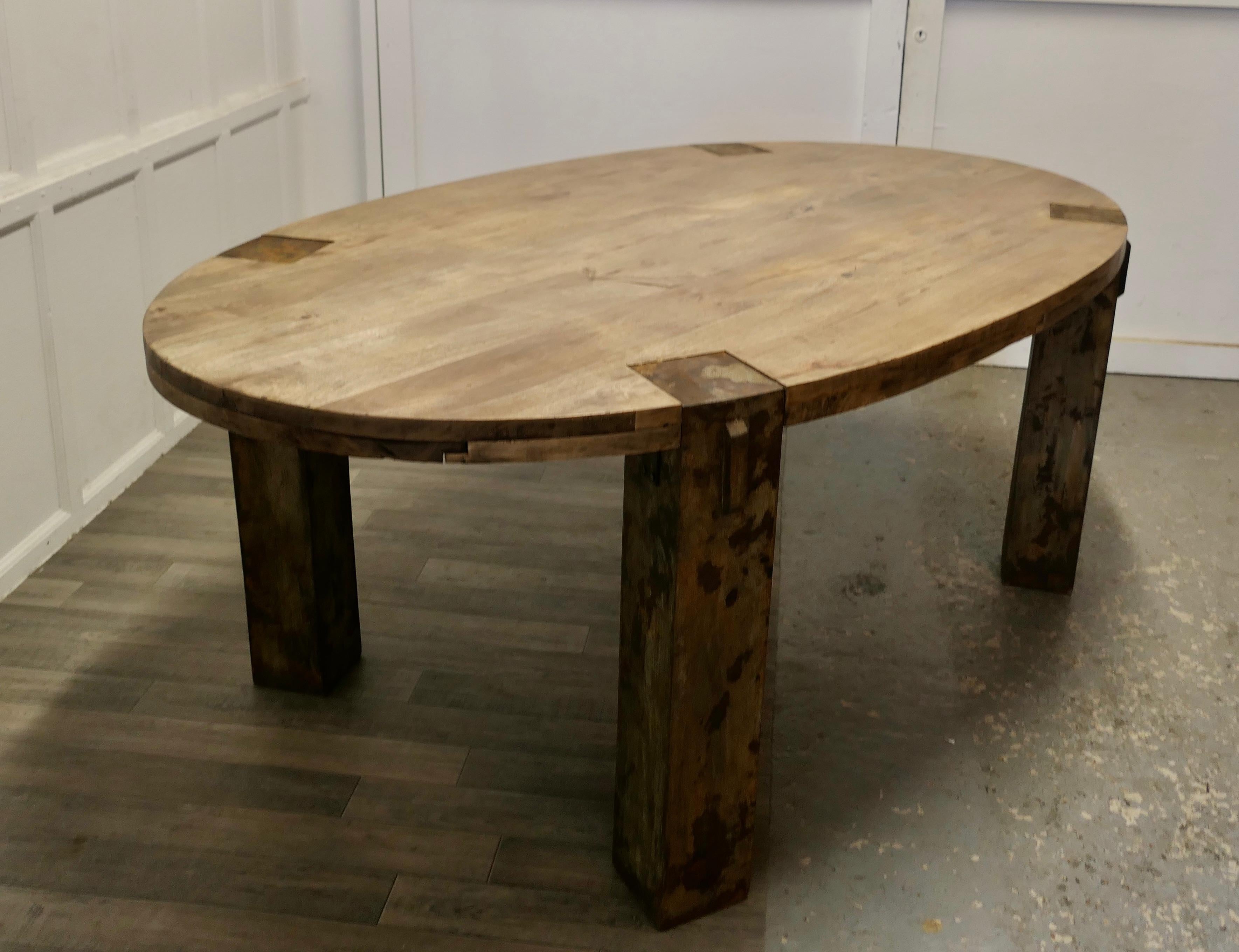 Large chunky oval dining conference table, industrial design
This is a superb piece, the table top is 3” thick and made from heavy planks of solid walnut, the wood has a slightly rustic appearance, the legs are 6” square and have been finished in
