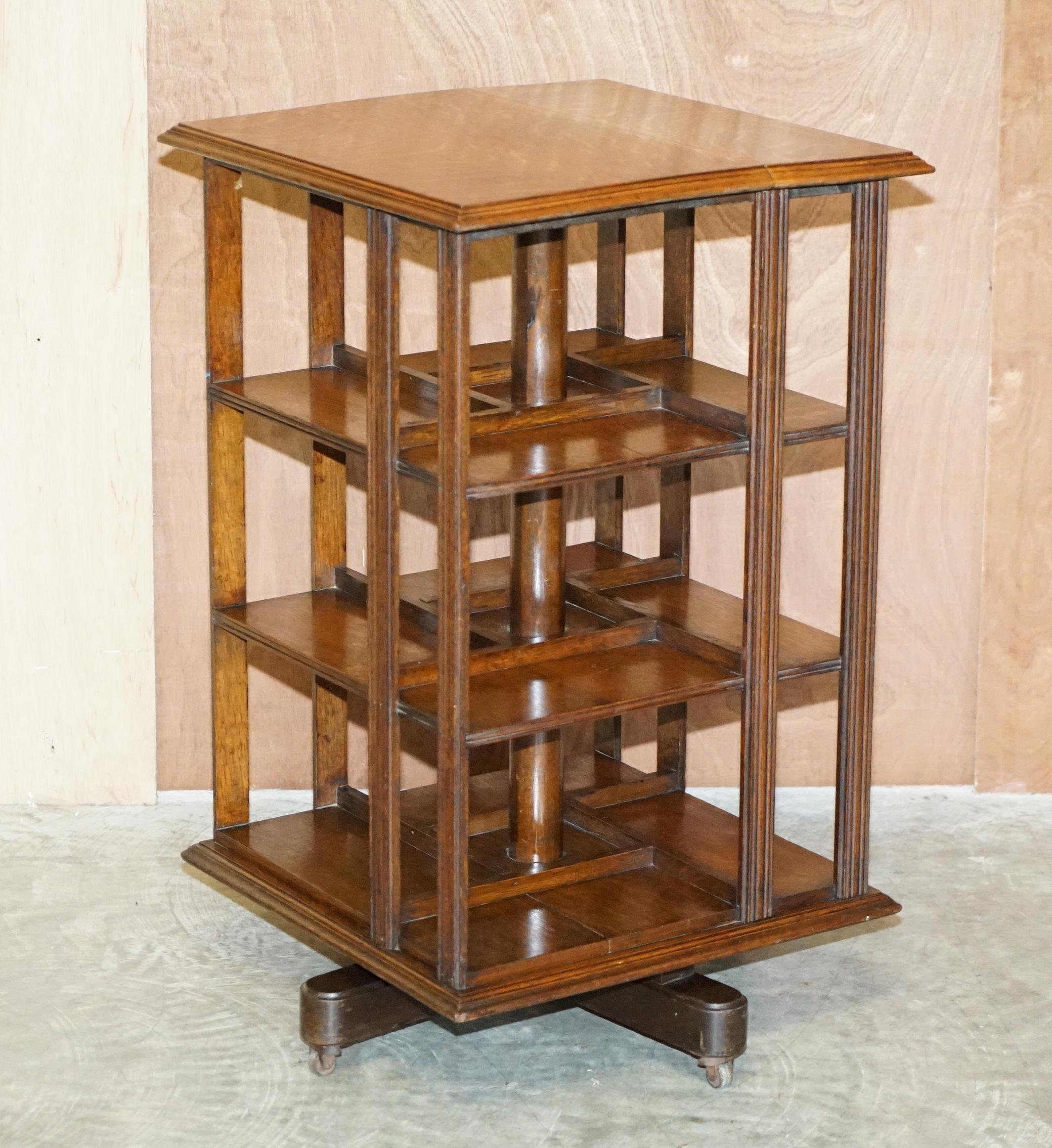 We are delighted to offer this very well made English oak circa 1880-1900 revolving bookcase table with newspaper shelf 

A good looking and well made piece, you can fit an entire at home personal library in this thing, it has a sorting table top