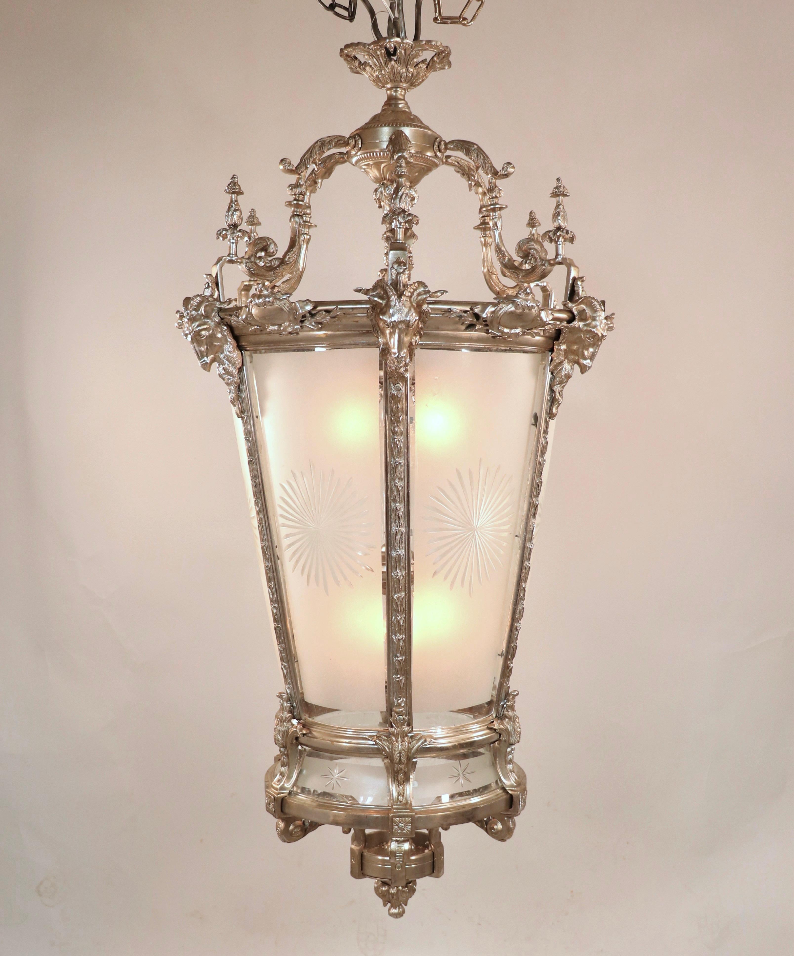 This exquisite modern lantern showcases the elegance of the French Louis XV style, crafted from nickel on bronze. Although the exact date of production is unknown, it is believed to have been commissioned after a period lantern, as it is entirely