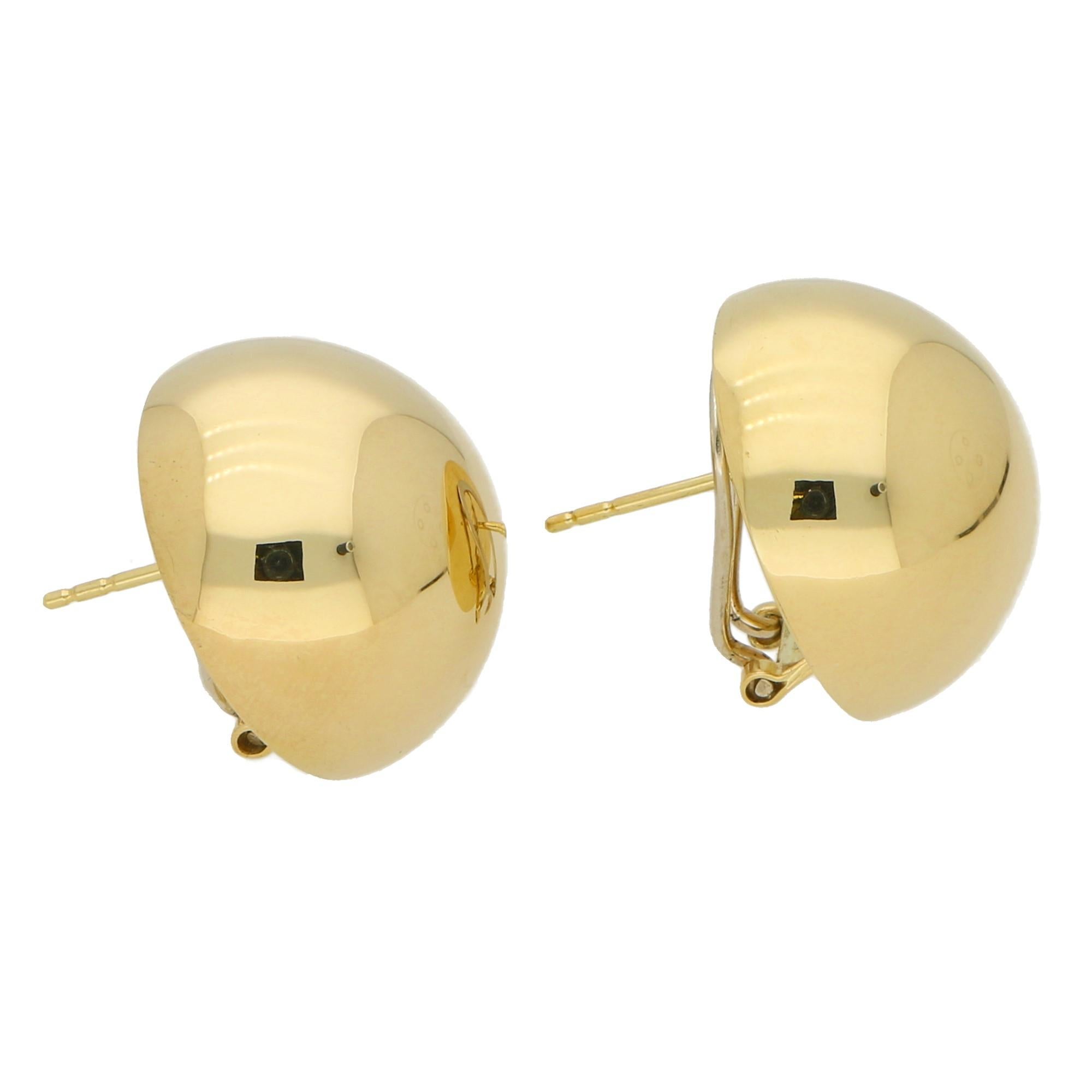 A lovely pair of large domed circular earrings made of 14k yellow and white gold.

The beauty of these earrings lies in the design! Even though the earrings are a larger pair they are in fact wonderfully light and therefore you can comfortably wear