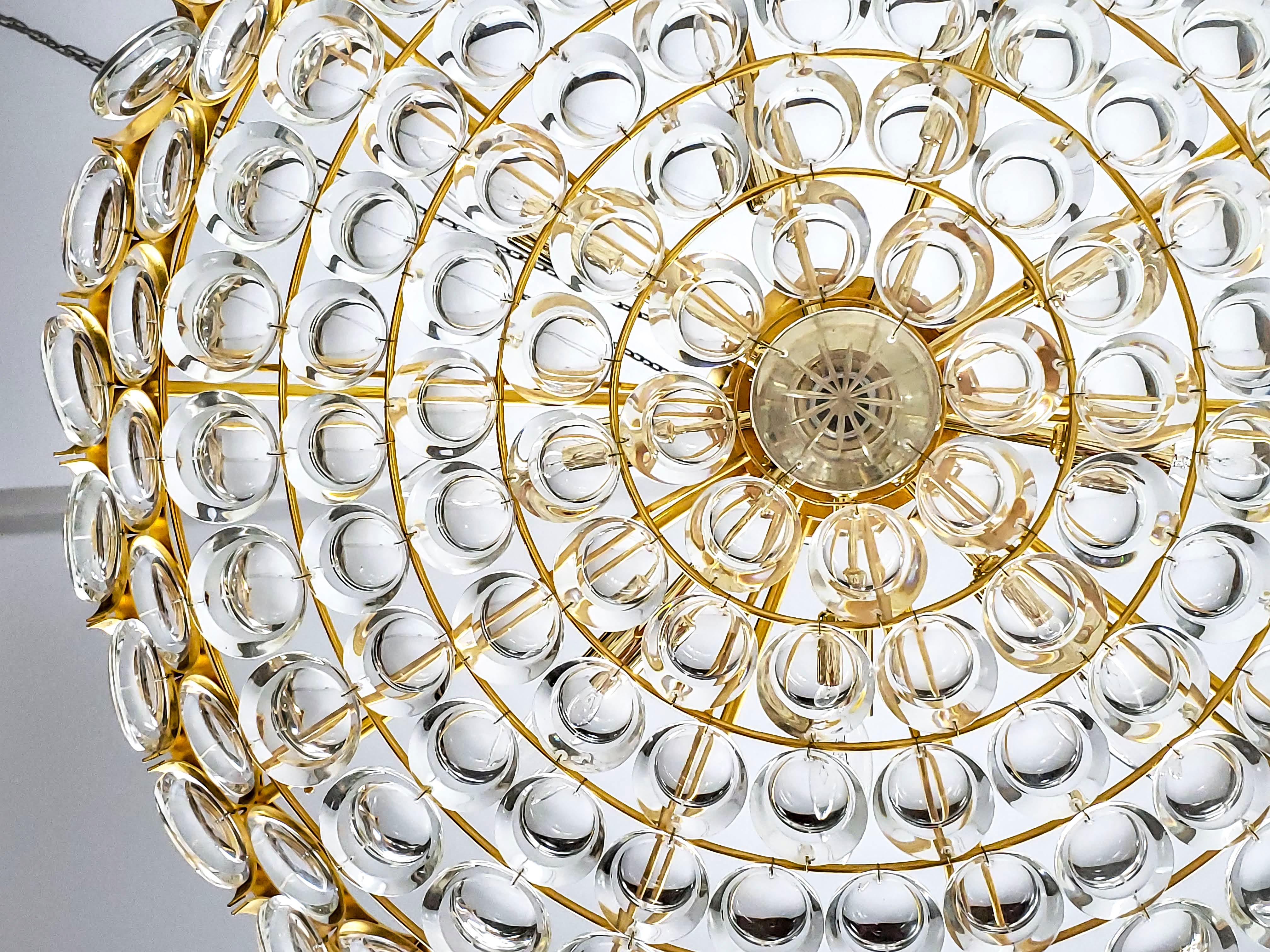 Mid-20th Century Large Circular Palwa Gilt Brass and Optical Lens Crystal Chandelier