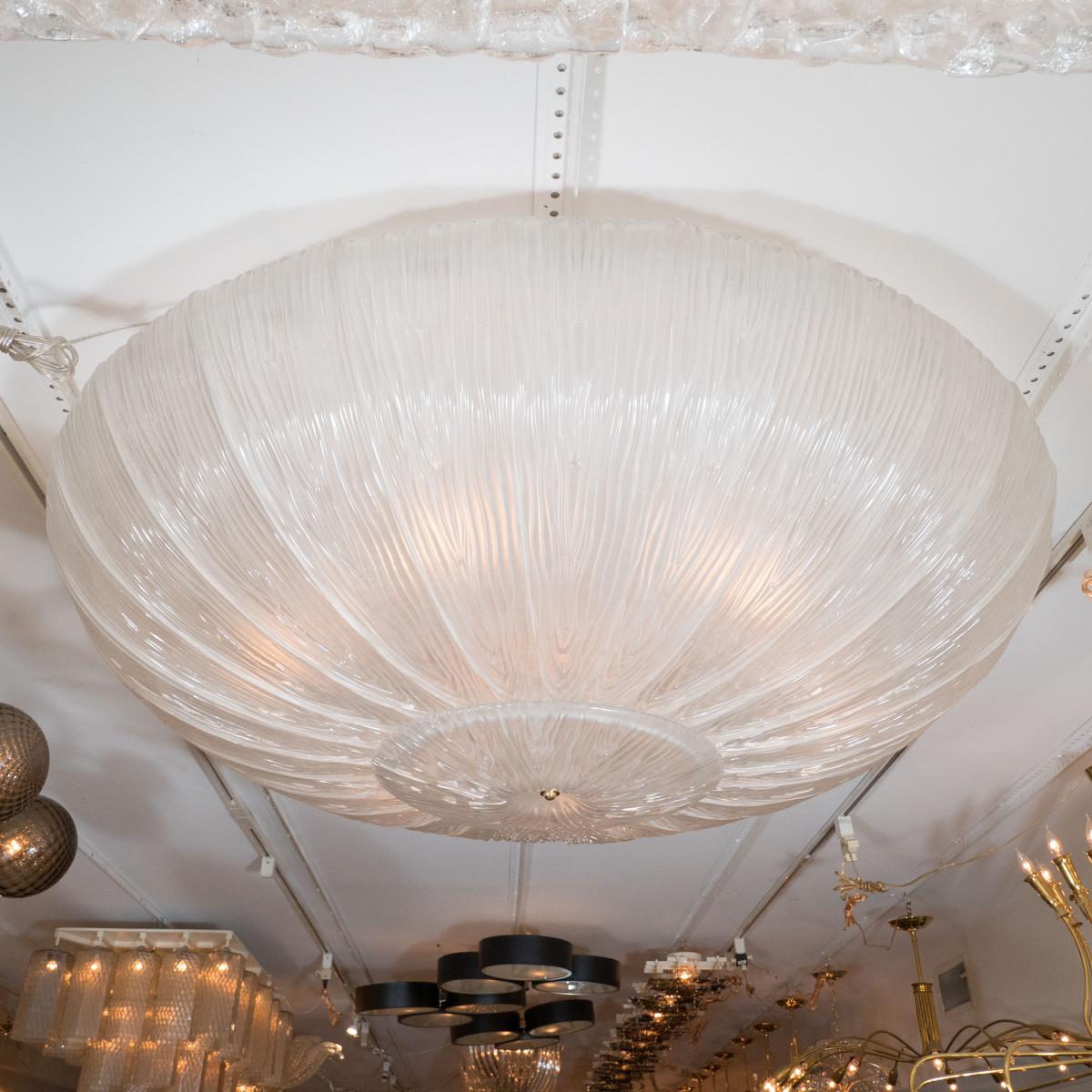 Large circular textured fluted glass ceiling fixture.