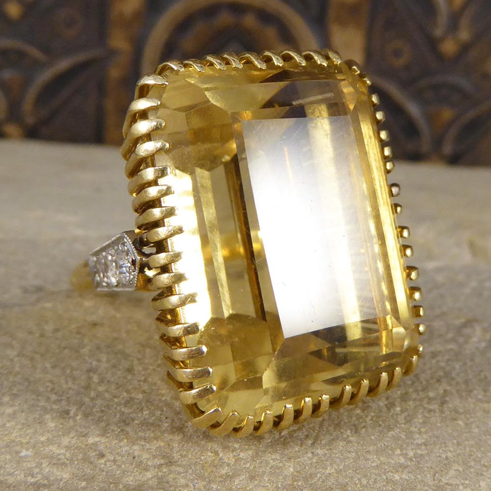 Looking for a large statement ring? This one holds a huge, over 50ct Citrene, held securely into place with many 18ct yellow Gold claws. Connecting the 18ct yellow Gold band and the head of this ring sits three Diamonds in an 18ct white Gold setting