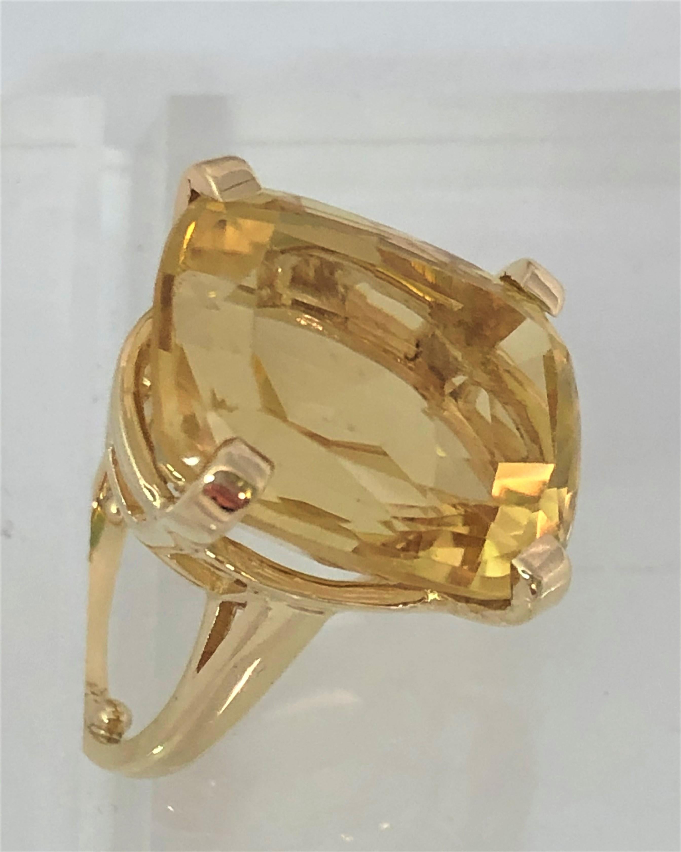 This ring will get noticed from across the room!
Approximately 19 carat, honey-colored Citrine mounted in a 4 prong basket setting
Citrine stone is approximately 20mm x 16.5mm x 11.8mm
14K yellow gold basket setting
Size 6 with sizing beads (fits