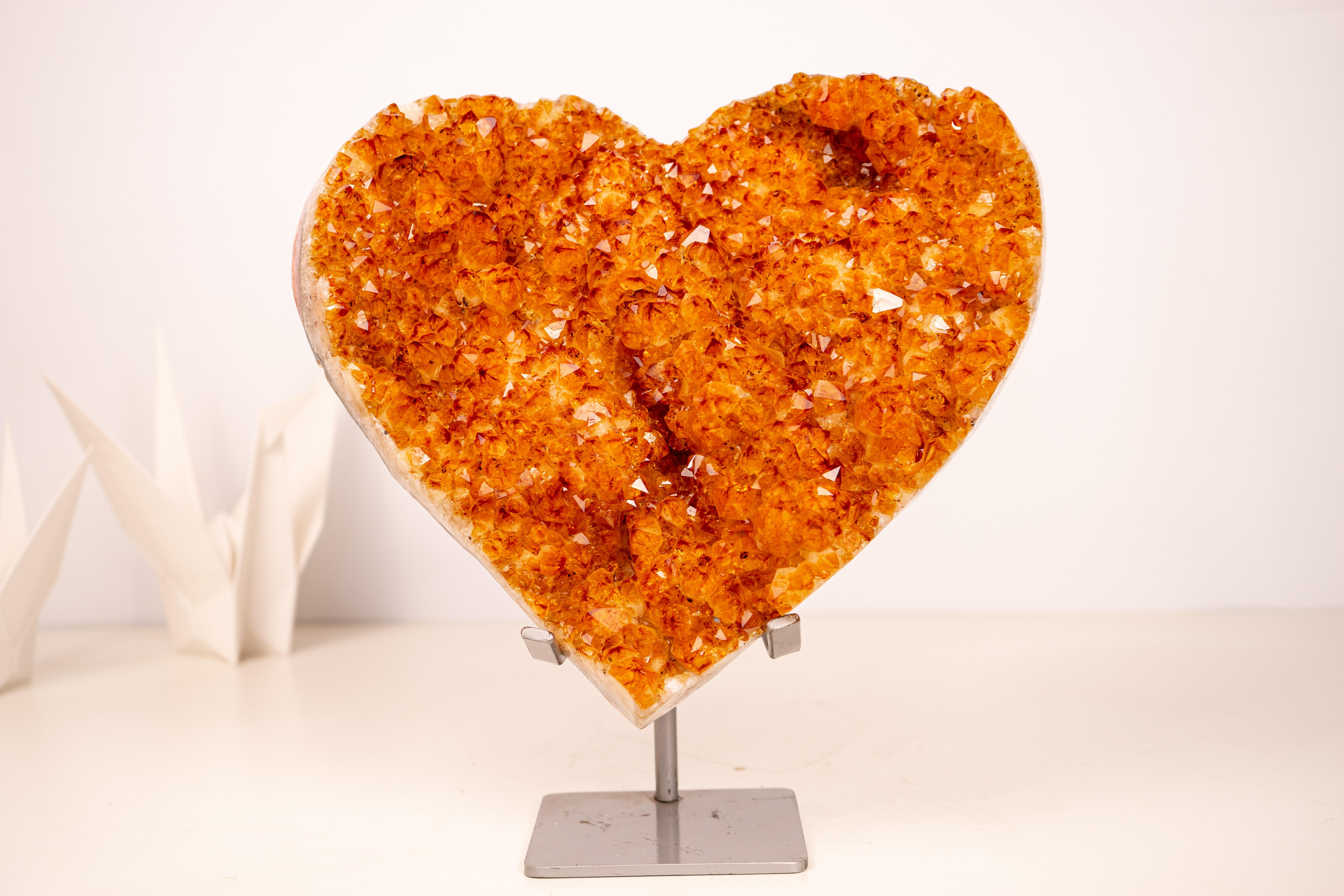 Citrine Heart with Sparkly, Intense Orange Druzy

▫️ Description
A beautiful, large, and unique Citrine heart filled with special characteristics, such as the sparkling, intense orange color that beautifully covers flower-shaped rosettes. It’s