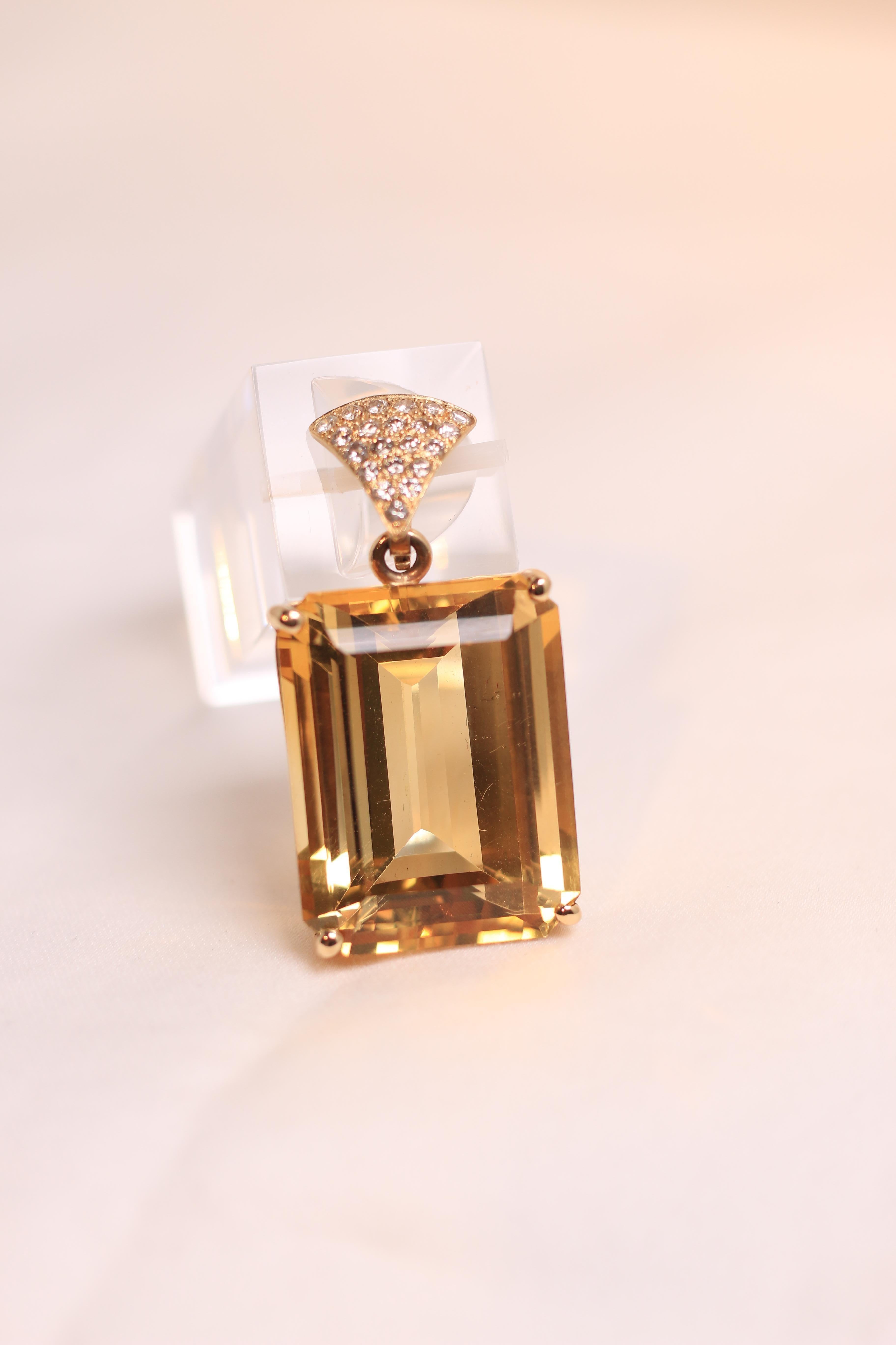A beautiful piece of history.  Citrine Emerald Cut with Yellow Gold and Diamond Bale.  
Estimated Weight 65 Carats
20.79 Grams

Traditional Basket Setting 

