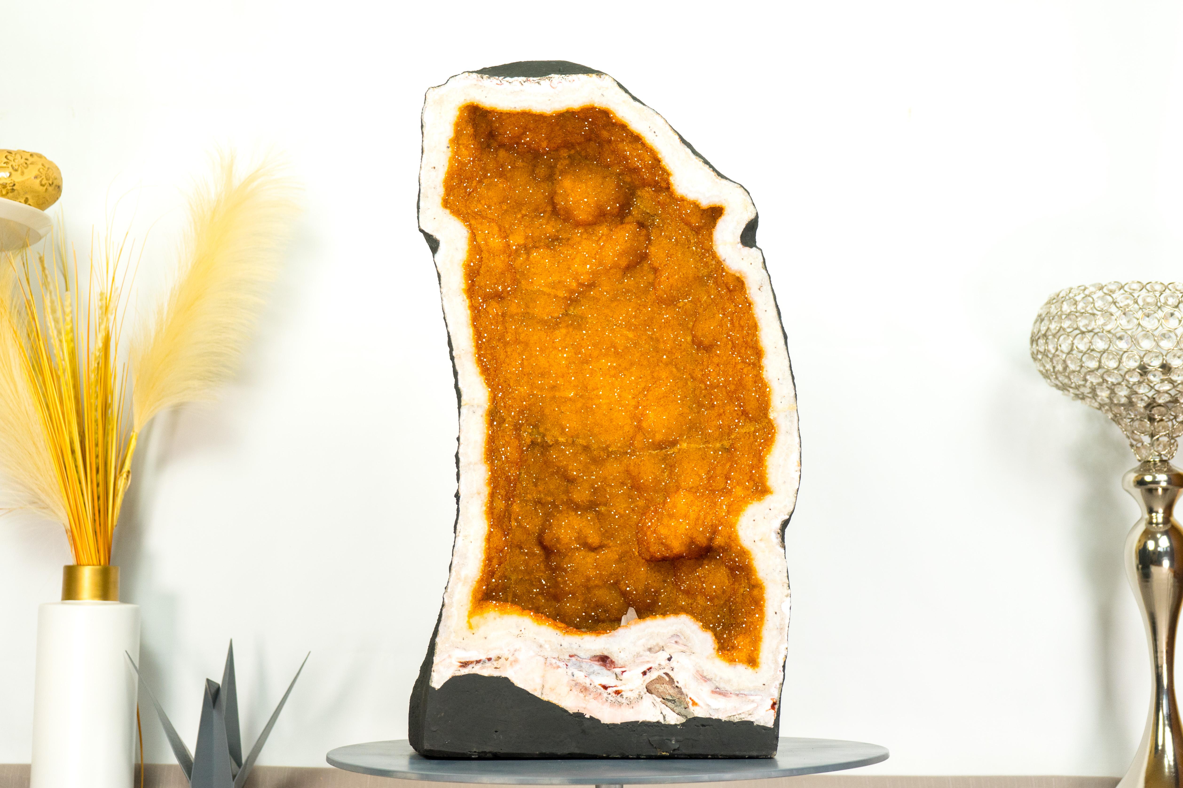 A truly unique and stunning geode, this golden yellow Citrine geode brings together rare characteristics with beautiful aesthetics. It is a geode that will certainly become a statement piece in your collection or a natural artwork to add to your