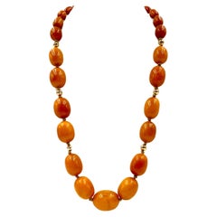 Grand collier classique en perles d'ambre baltique caramel et or 14K