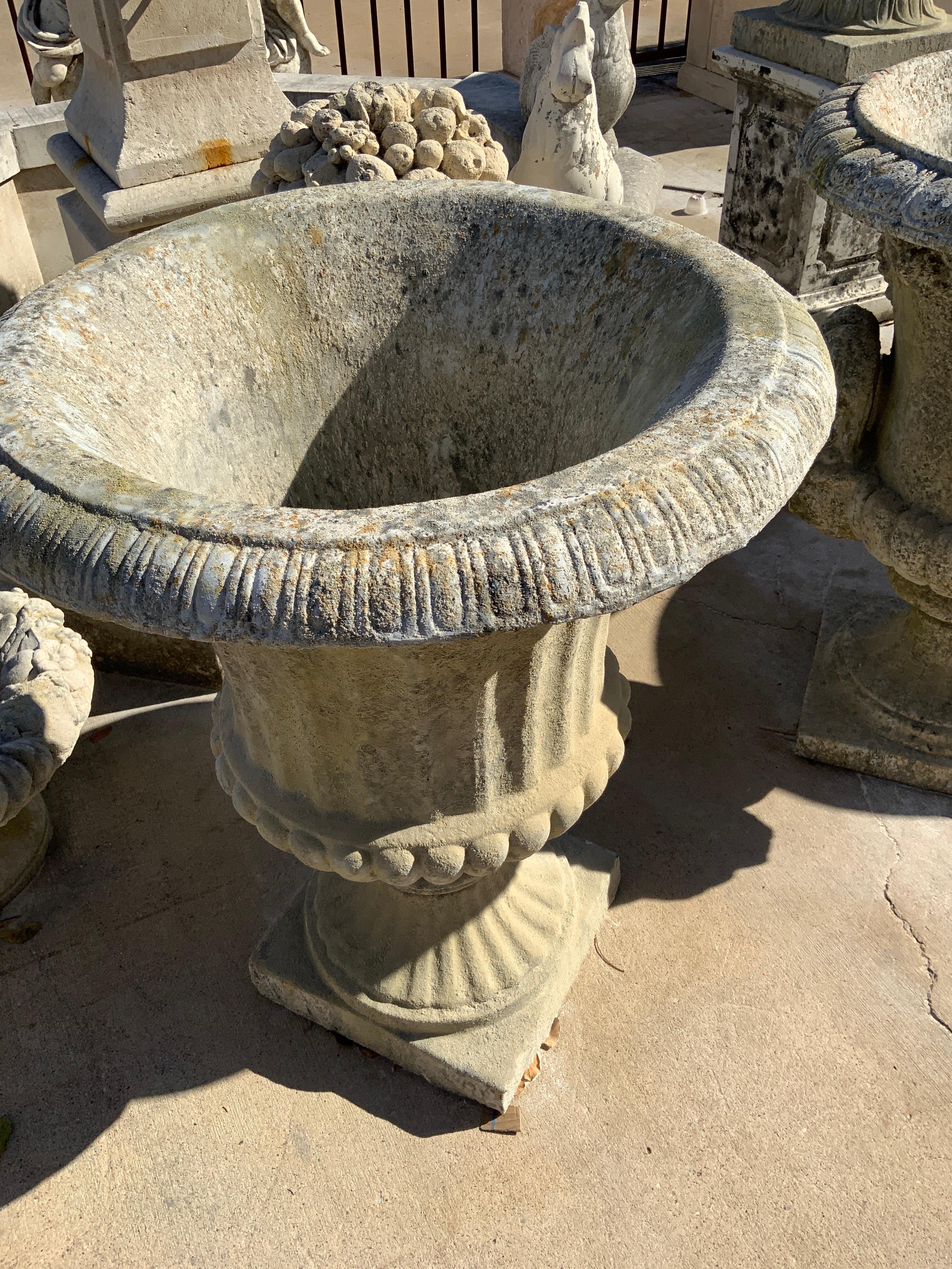 Fluted classical urn from our Medici collection. Made from exterior grade plaster with granite aggregate, this urn is frost-free and non-absorbent.