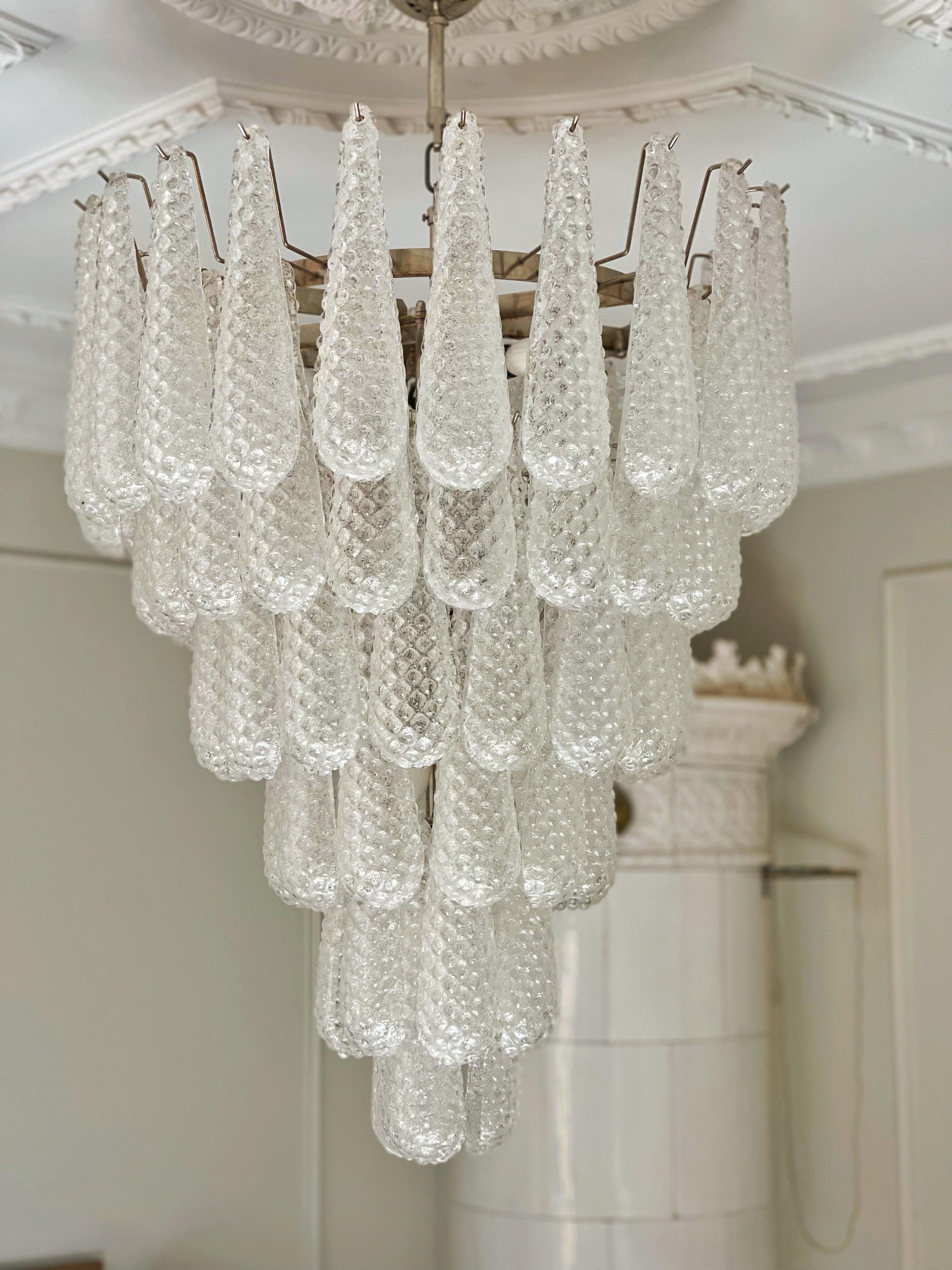 Huge Murano Glass Chandelier with Drop Formed Glass Prisms.  Contemporary Chandelier in Traditional Italian Mid-Century Style.
The chandelier is composed of 75 Crystal Prisms in the size of 29 x8 cm (11.4