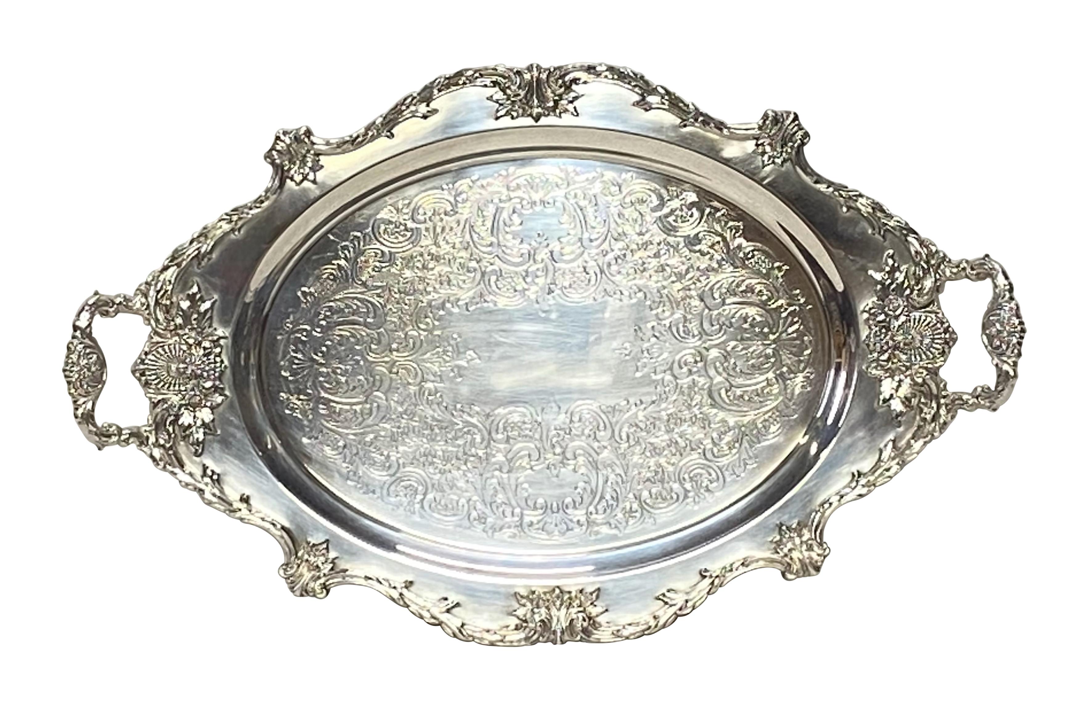 A large Classic style two handled and footed silver plate serving tray, marked Christopher Wren by Wallace.
American, mid-20th century.
In excellent condition.



