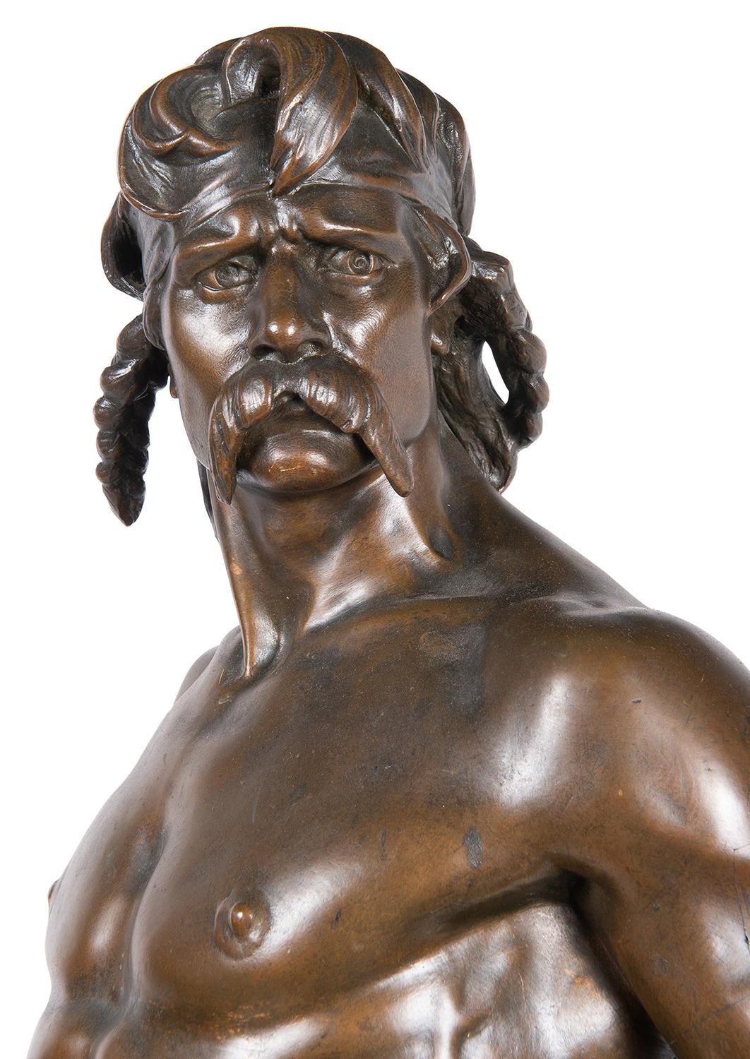 Emile Andre Boisseau (1842-1923, France) bronze sculpture of a man wearing a fur loin cloth, he holds a sword in one hand and leans beside a farmer’s plow; titled on a brass plaque on the front in Latin and French 