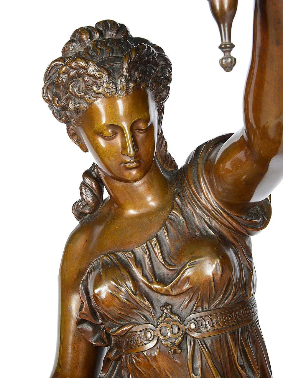 A wonderful quality pair of large 19th century French patinated bronze classical female statues / lamps. Each depicted beautiful maidens dressed in flowing drapes, mounted on carved giltwood pedestals. Measures: 170cm (67").