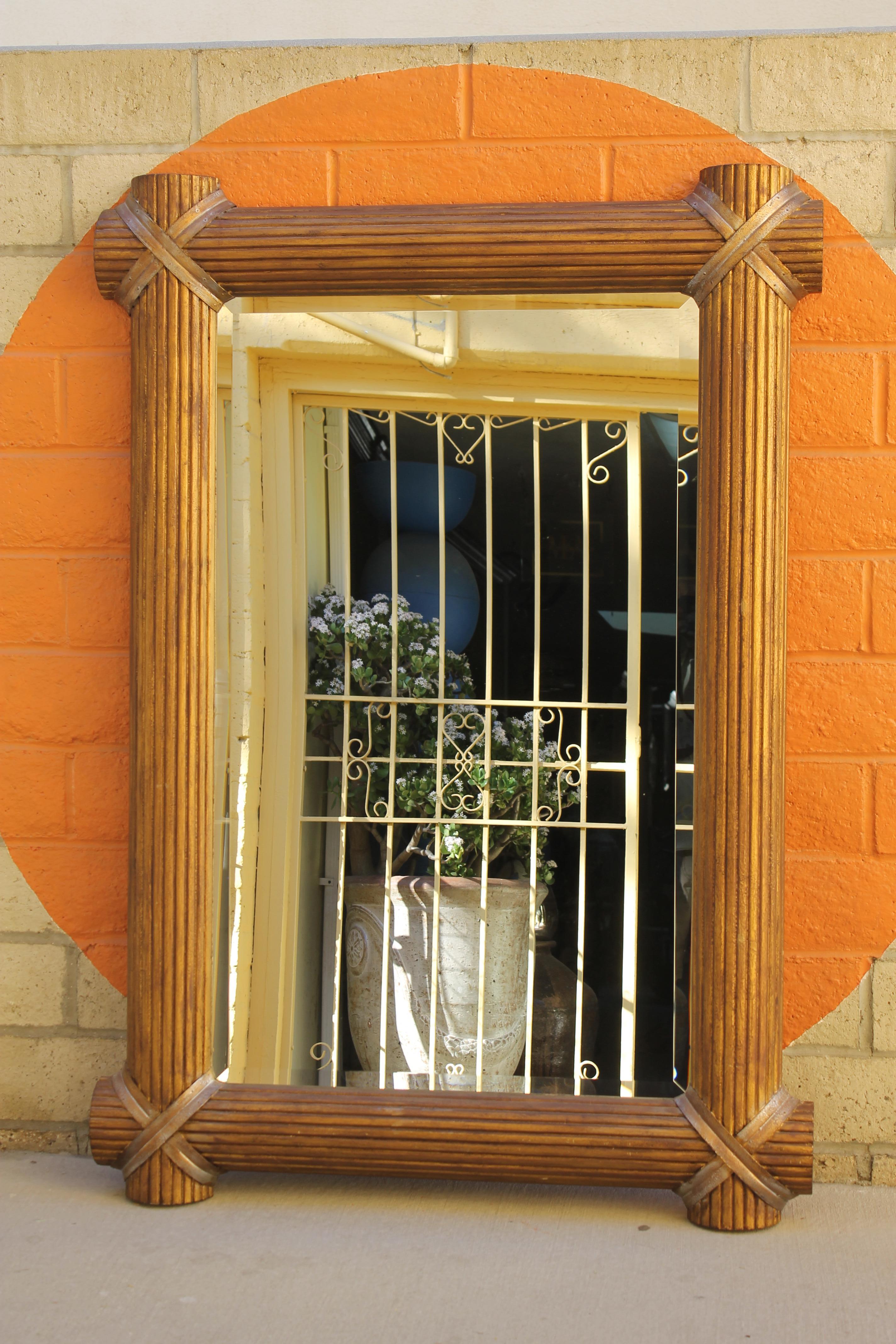 A substantially sized mirror featuring beveled glass and a 5.25