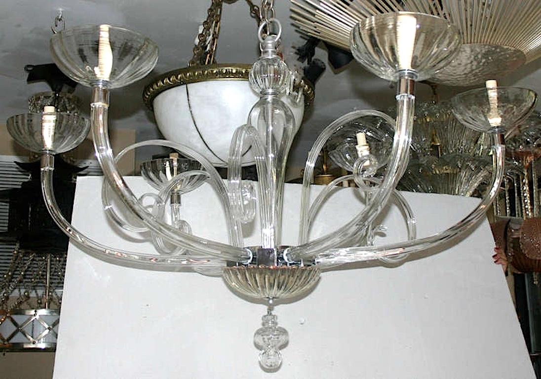 A circa 1940's Italian Venetian glass 6-arm chandelier with curled decorative elements coming out of center body, mercury glass canopy and bottom body.

Measurements:
Height: 36