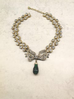 Large clear paste and emerald poured glass  'bow' necklace, Chanel, 1980s