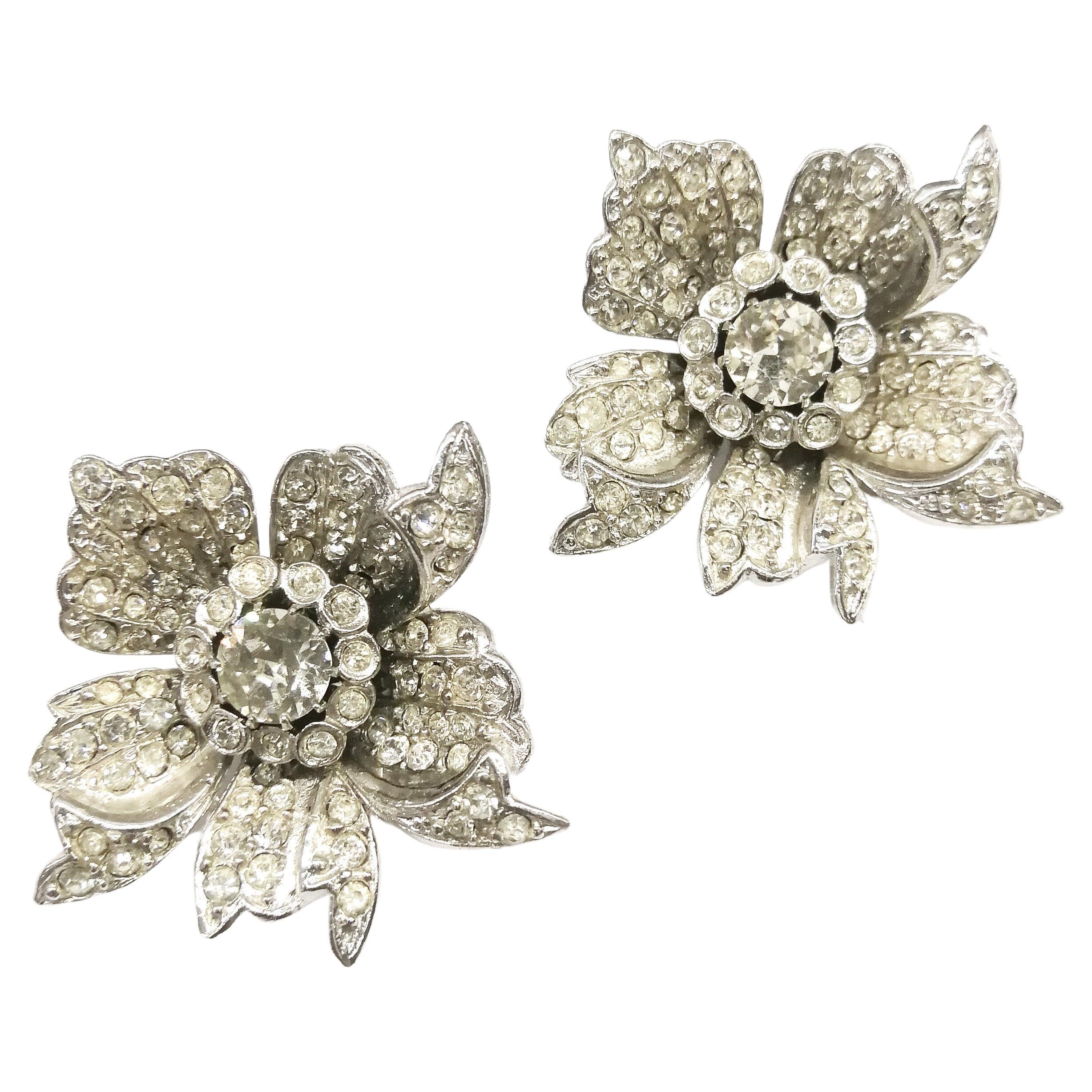 A striking pair of paste earrings in the form of a flower or rose, from the early 1950s. Although unsigned (as often happened with a brooch and earrings, where the brooch was signed and the earrings not signed), they are without doubt the matching