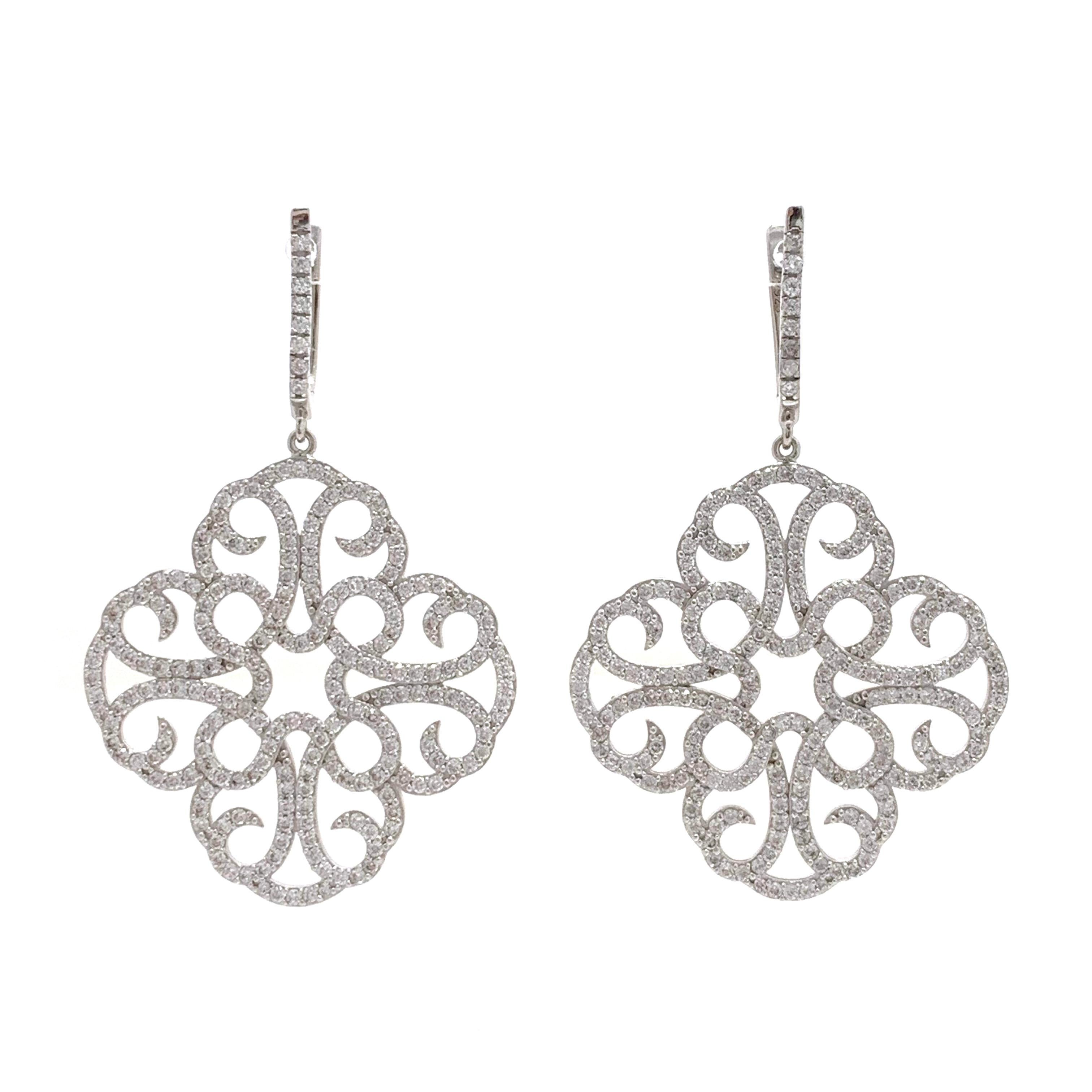 Large Clover Faux Diamond Drop Sterling Silver Earrings

The earrings feature over 400 pcs of AAA quality round faux diamond cz , handset in platinum rhodium plated sterling silver.  Straight post with English lock closure. The earrings measured 2