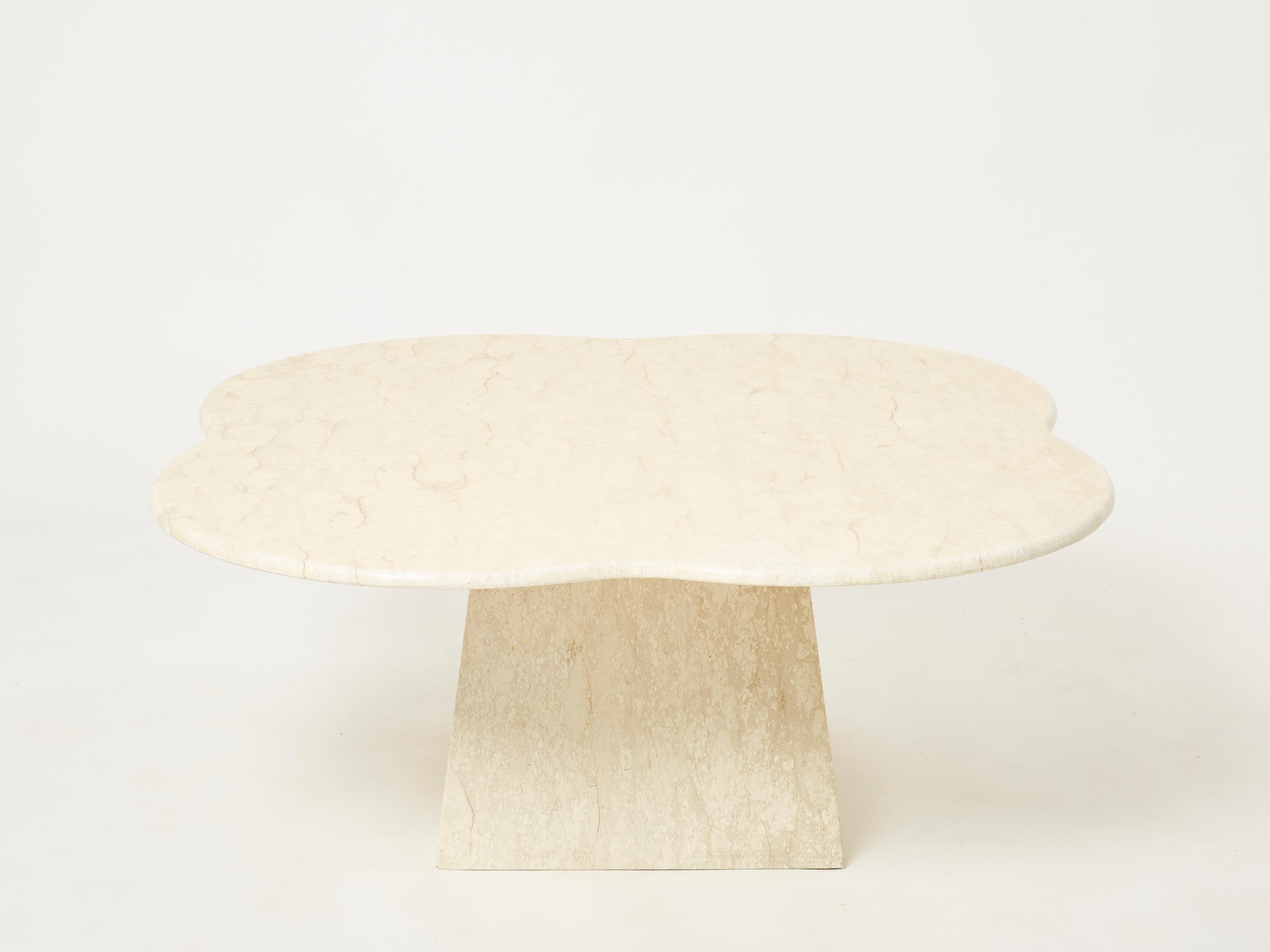Unique vintage coffee table produced in Italy in the early 1970s from a beautiful travertine marble. The thick clover shaped surface of this coffee table is so slick yet intriguing, with beautiful veins and colors, making it a centerpiece of the