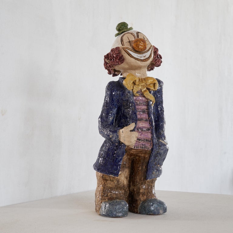 Oversized clown in glazed clay with great details.

A real fun piece, but very well designed and made. Large of size and rich in colour, this clown will provide you with a lots of smiles.

Due to the grand size this clown is very suitable to