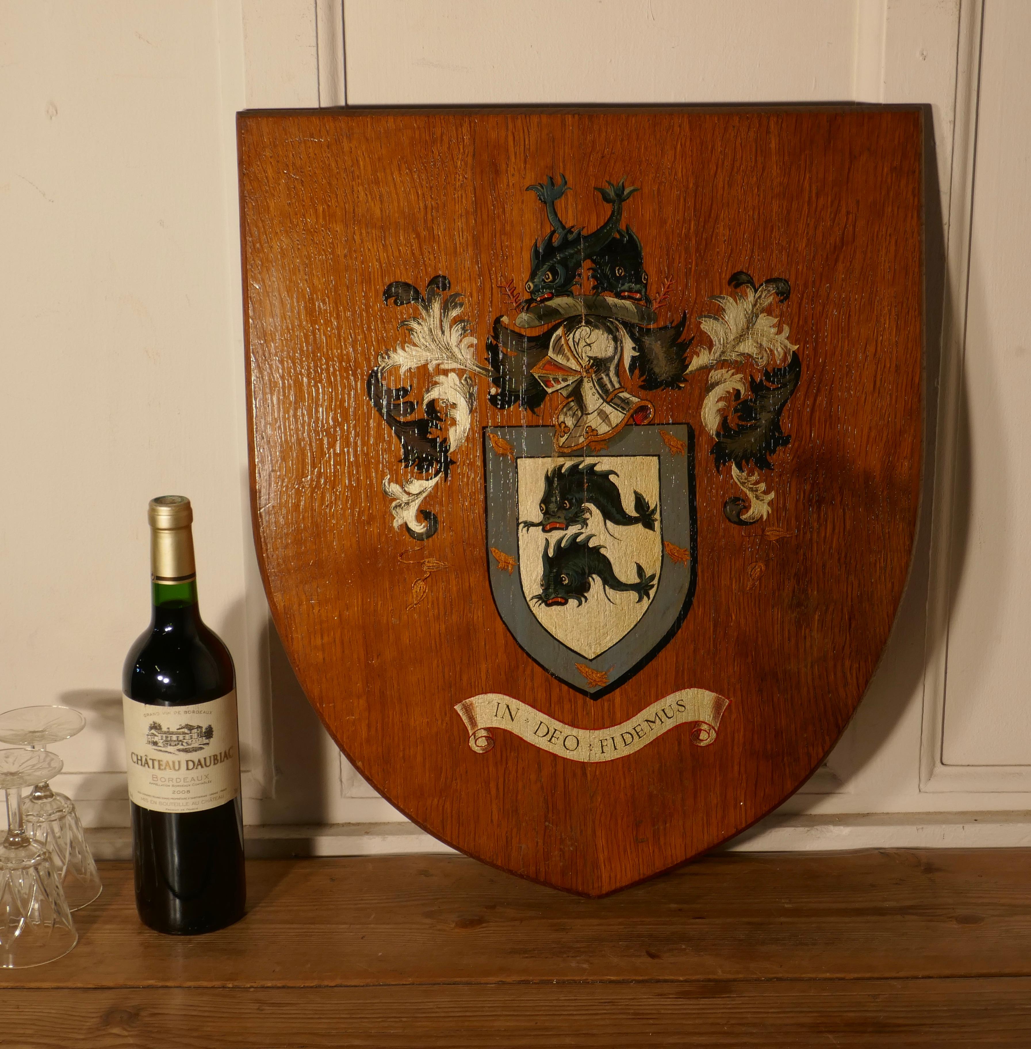 Large Coat of Arms of Brighton oak wall plaque / shield


The plaque is made in sold golden oak and painted in color, it has “IN DEO FIDEMUS” (The motto of Brighton) written on a scroll beneath a blue shield with Birds and Dolphins, around this