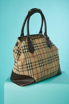 Large coated tartan and brown leather top handle bag Burberry