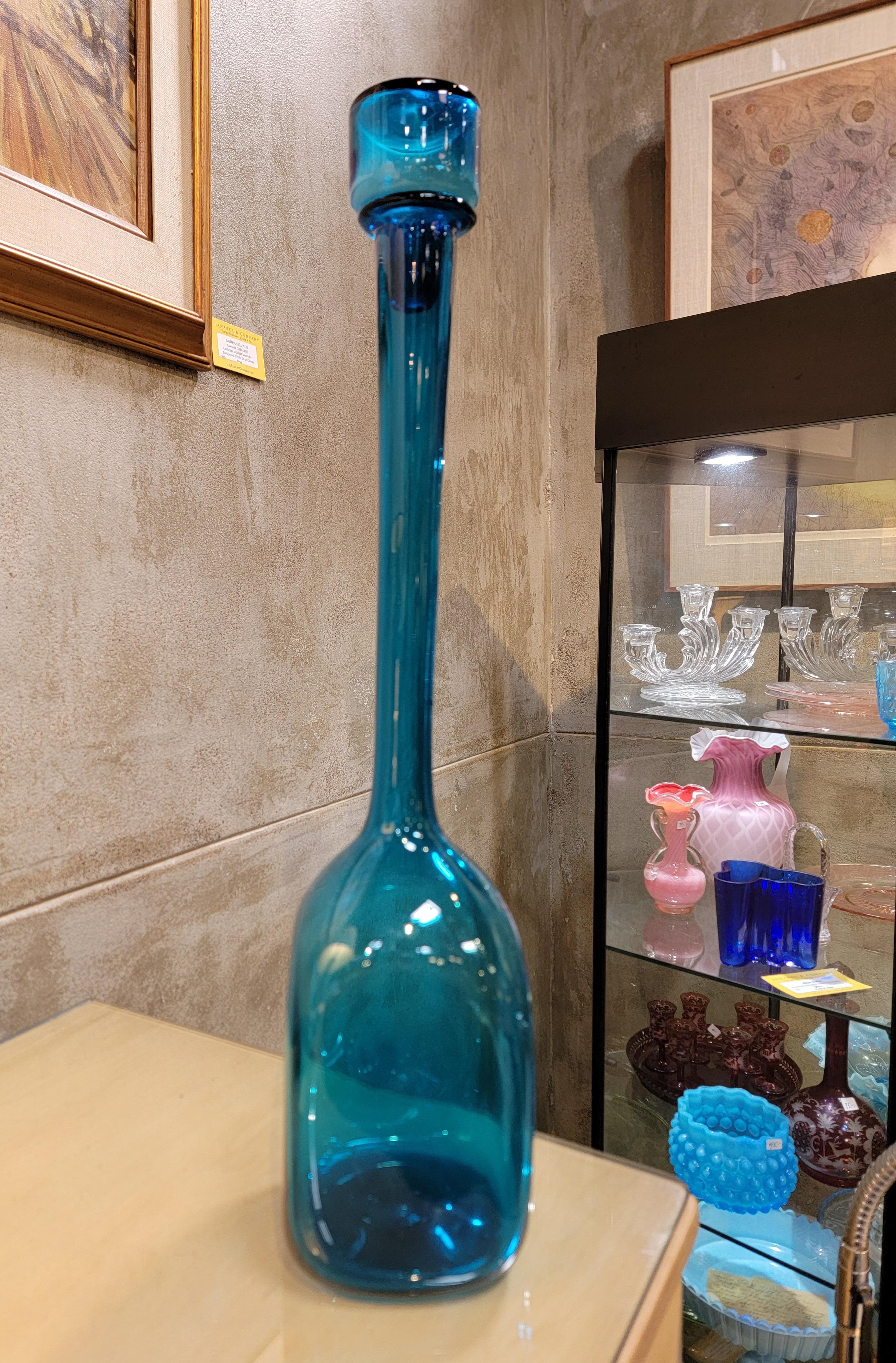 Colbalt blue blown glass decanter with stopper. Made in the manner of Blenko Glass. Circa. 1960's. Measures 22.25 inches high. 
