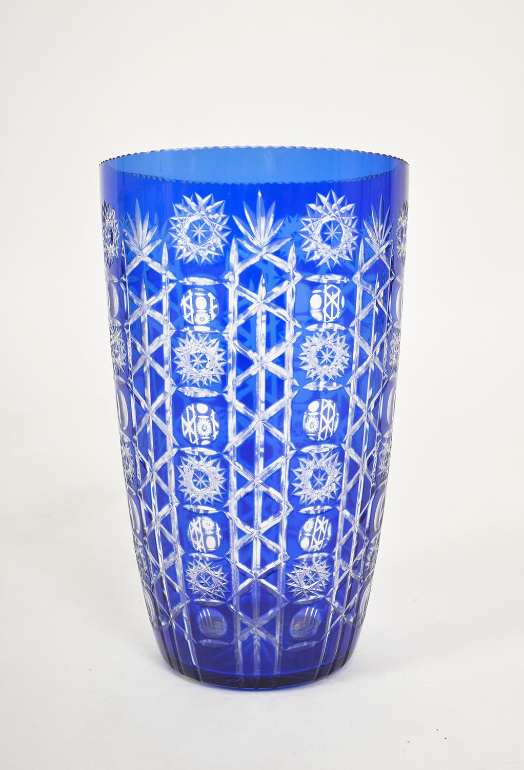 A large and striking cut crystal vase in cobalt blue made in Czechoslovakia. 
The vase has been very well cared for – the foot of the vase has four protect pads on the bottom and there are no chips, scratches or watermarks. The vase makes an