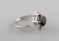 Large Cocktail Ring in 14 Carat White Gold with Oval Facet Cut Black Diamond