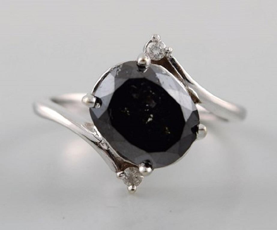 Modern Large Cocktail Ring in 14 Carat White Gold with Oval Facet Cut Black Diamond For Sale