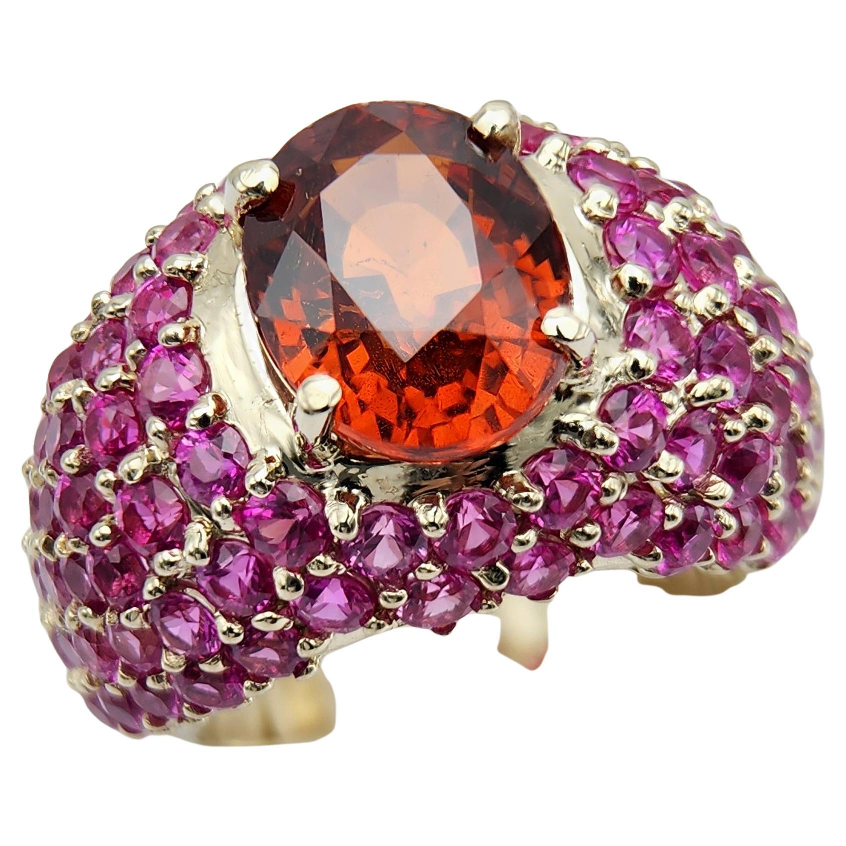 Pink Ruby & Spessartine-Orange-Red Garnet 
18k white gold 13.55 gram
Total small Ruby stones 5.40 carat
Center Garnet stone 5.62 carat from Tanzania and is Unheated and Untreated (11 x 9 mm)
finger size 7