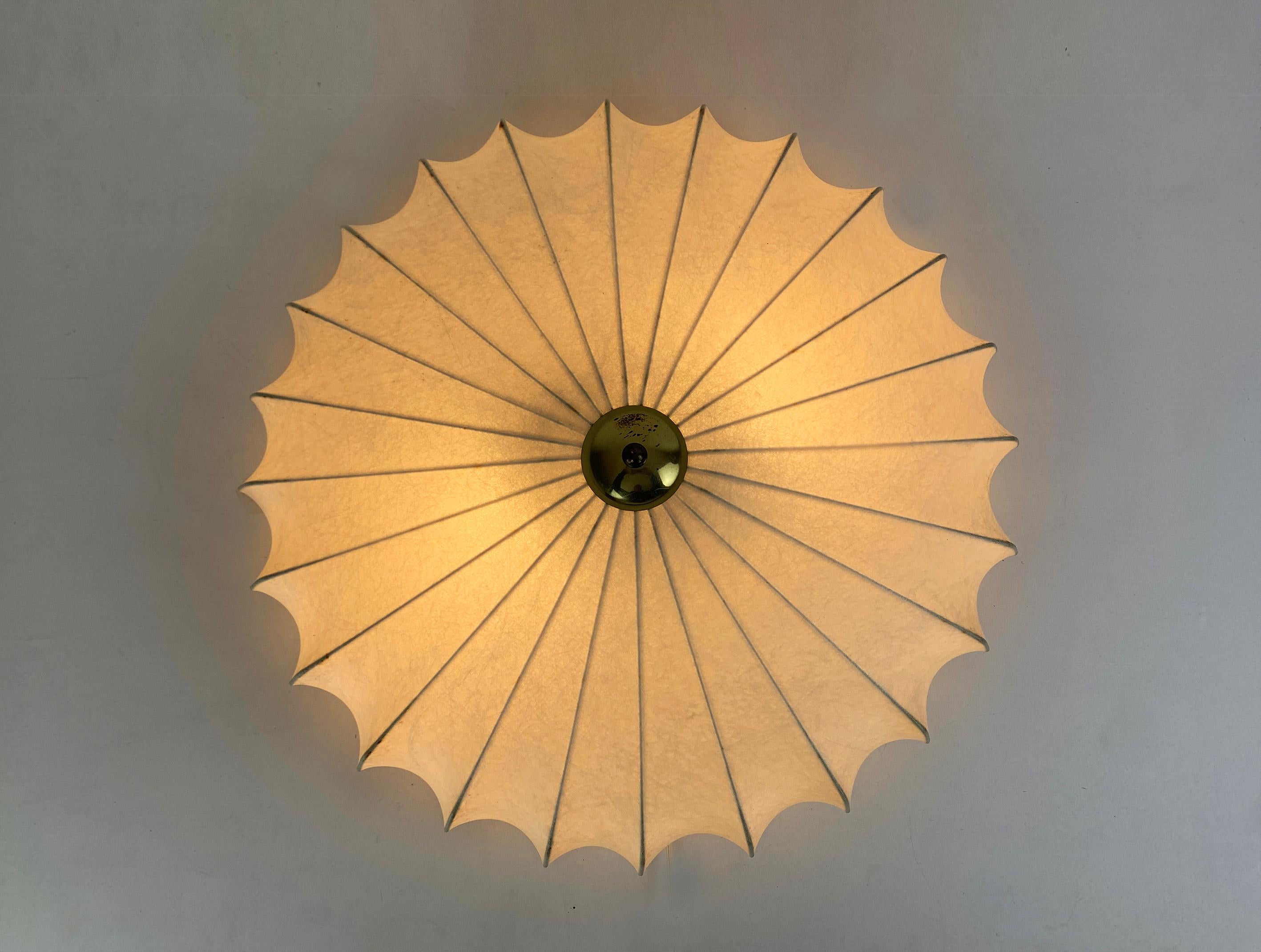 Cocoon lamp, design by Friedel Wauer. Manufactured by Goldkant Leuchten, Germany in the 1960s.
A thin steel framework covered with sprayed resin gives a Fiberglass look. The translucent resin gives a beautiful soft light effect. A great example of