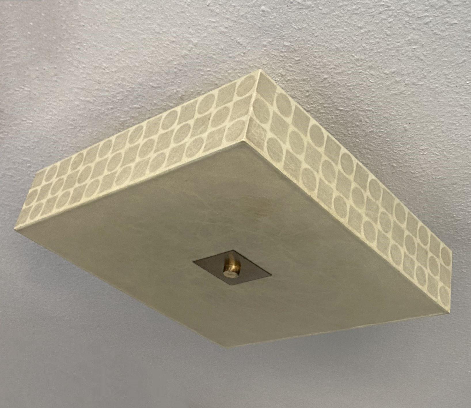 Large Mid-Century square shape cocoon four-light flush mount, ceiling light  in the style of Achille Castiglioni, manufactured by Goldkant in Germany during the 1960s. With geometric details on the four sides and brass galery in the center. It takes