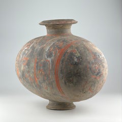 Large Cocoon-shaped jar with cloud-scroll design, Han Dynasty