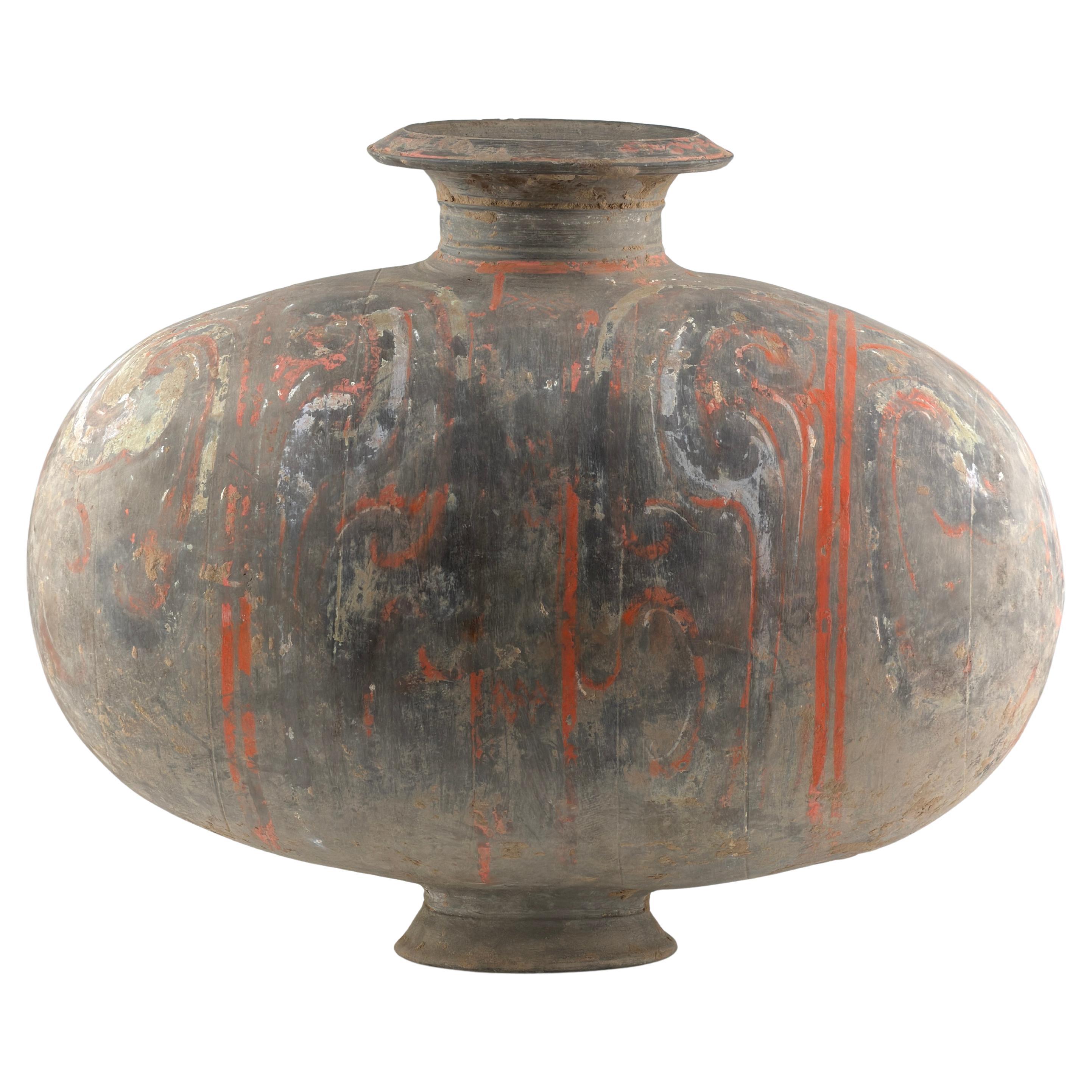 Large Cocoon-shaped jar with cloud-scroll design, Han Dynasty