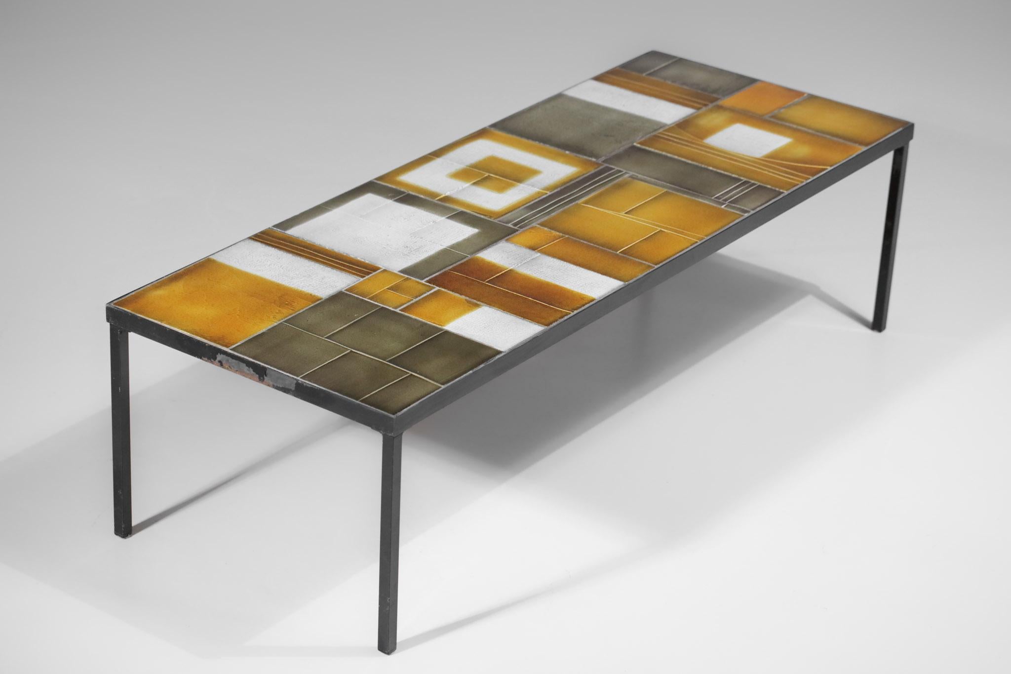 Large coffee table by the famous French ceramist Roger Capron from the 1960s with rather rare proportions. Steel structure and top made of ceramic tiles of different sizes representing very decorative abstract geometrical patterns. Tiles in very