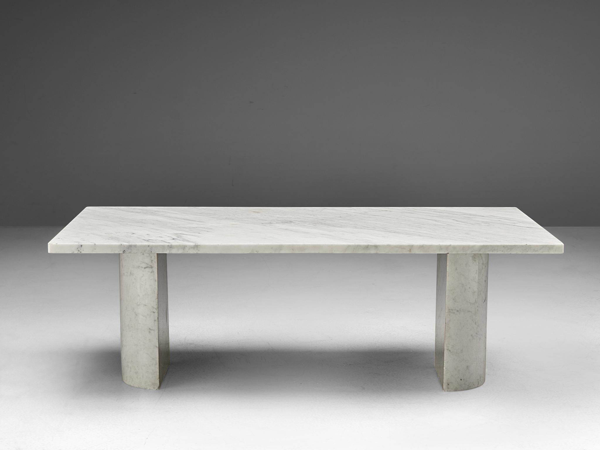 Coffee table, Carrara marble, Italy, 1970s

This large cocktail table features a rectangular shaped table top of 1.50m/59in. The top is supported by two semi-circular columns. The aesthetics are typical for postmodern design, bearing references to