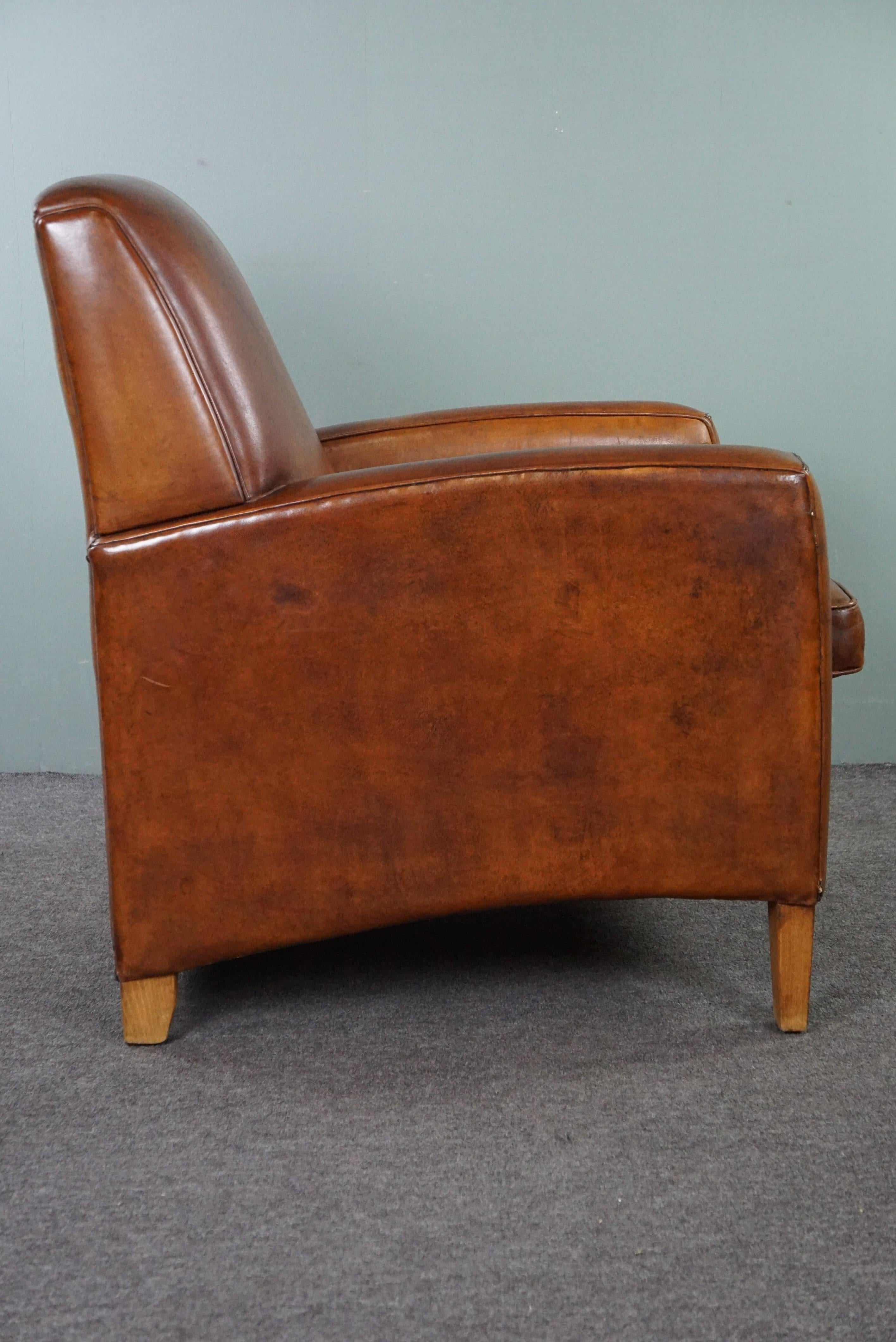 Large cognac-colored sheep leather armchair in good condition with a sleek desig In Good Condition For Sale In Harderwijk, NL
